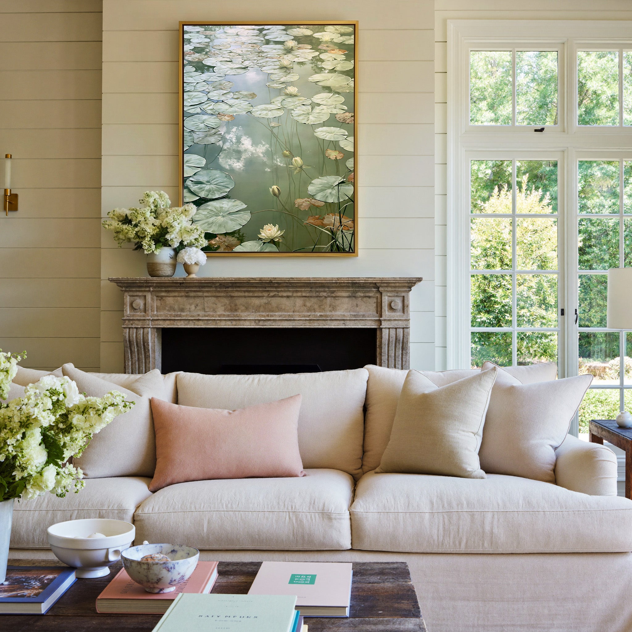 pale lily pads and white blossoms canvas wall art in a gold frame above a mantel