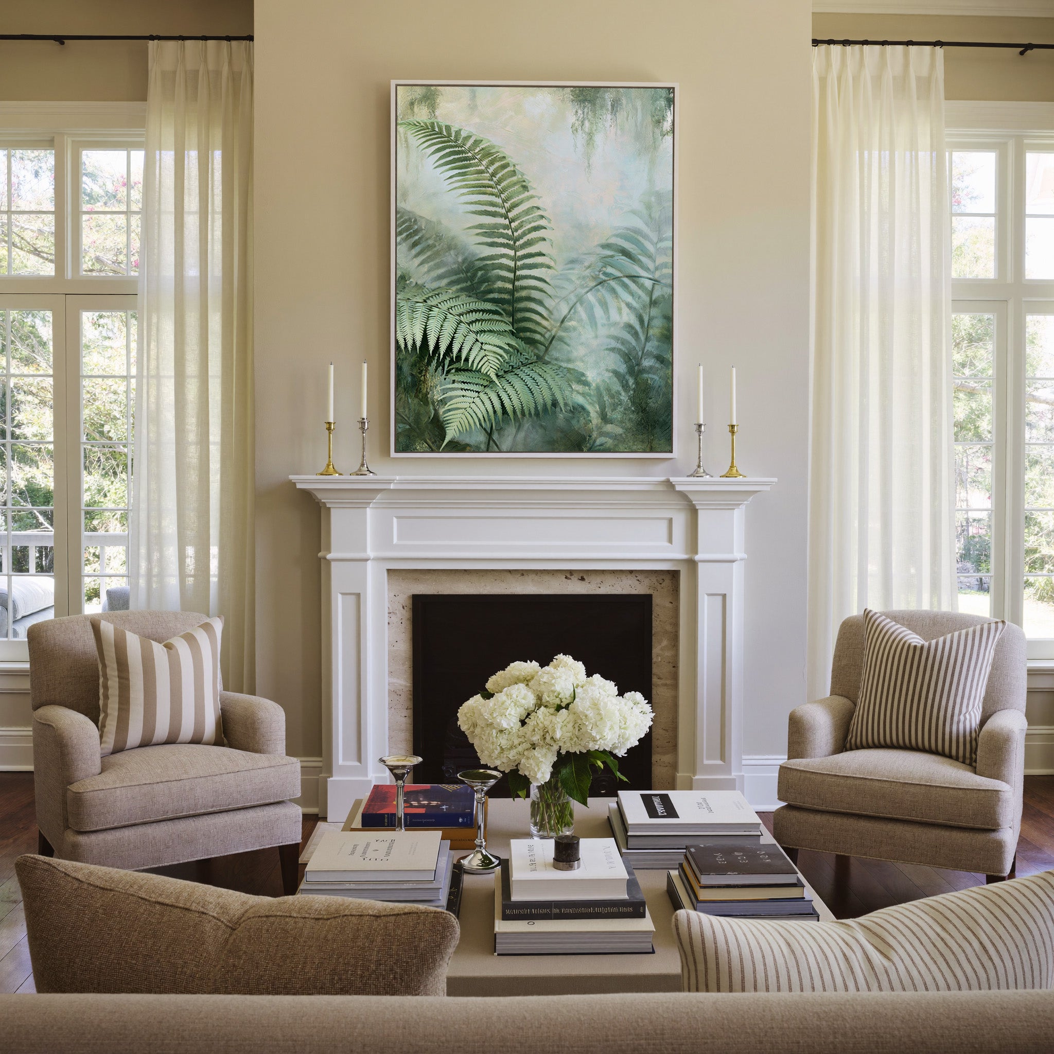 layered green fern fronds in a misty pale canvas wall art in a white frame above a mantel