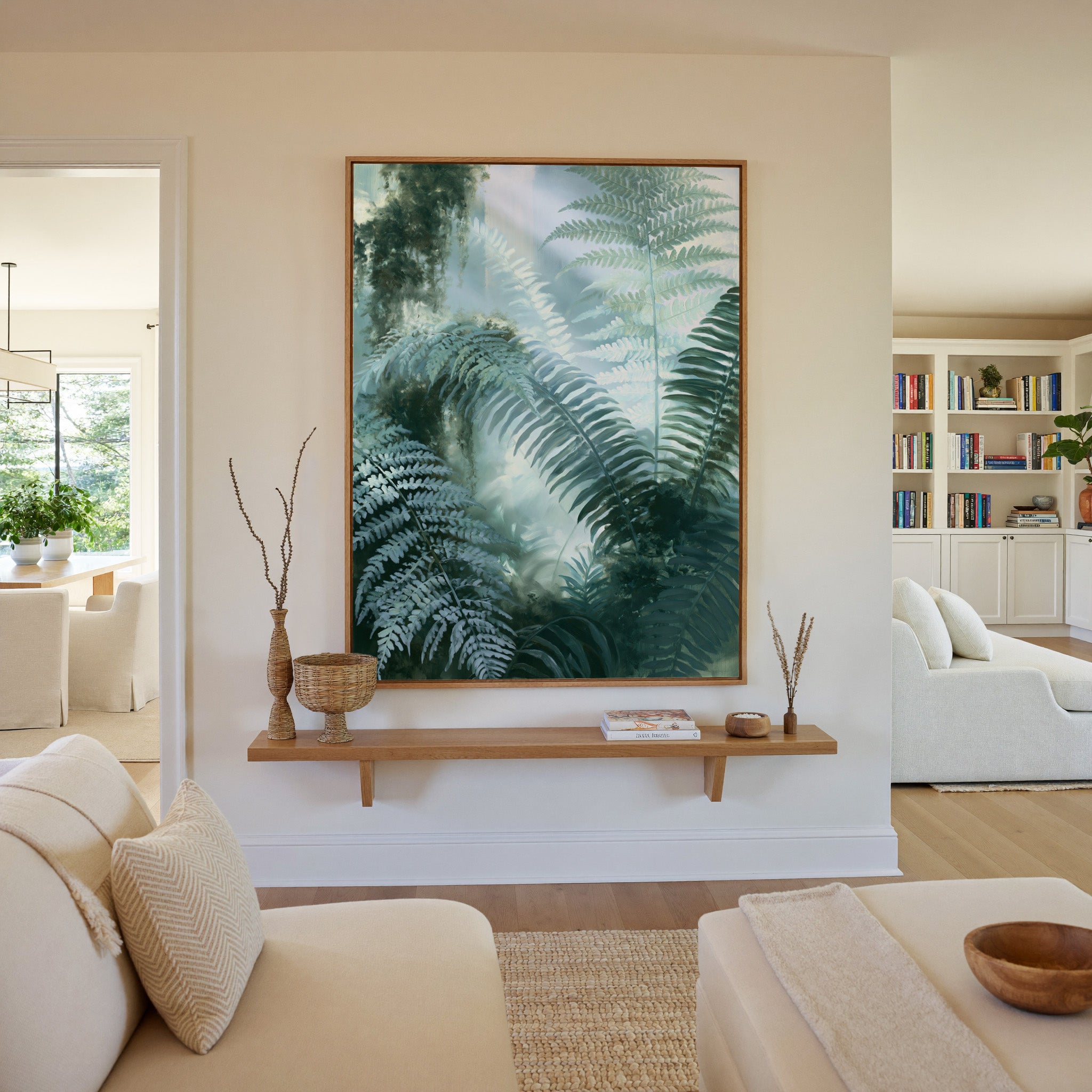 soft green fern fronds over a misted blue gray canvas wall art in an oak frame in a living room