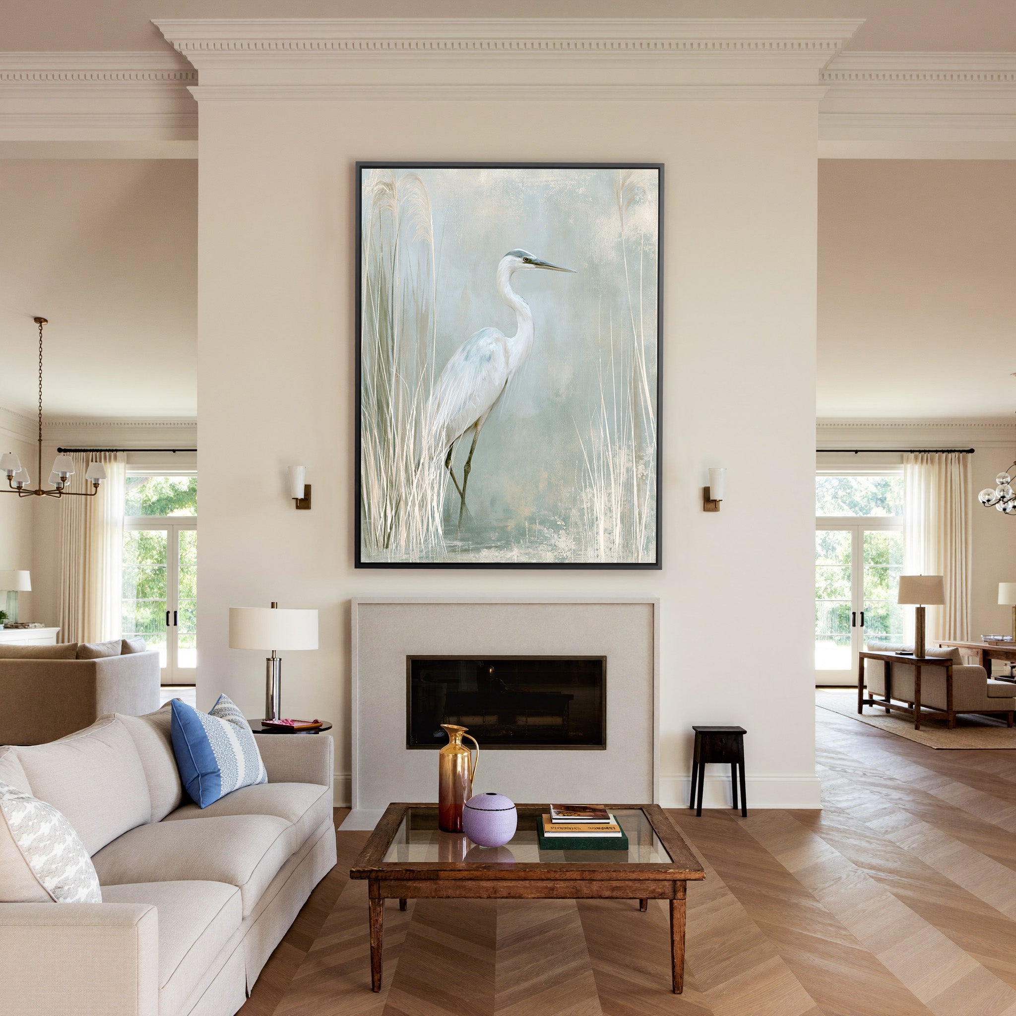 white heron among pale marsh reeds canvas wall art in a black frame above a mantel