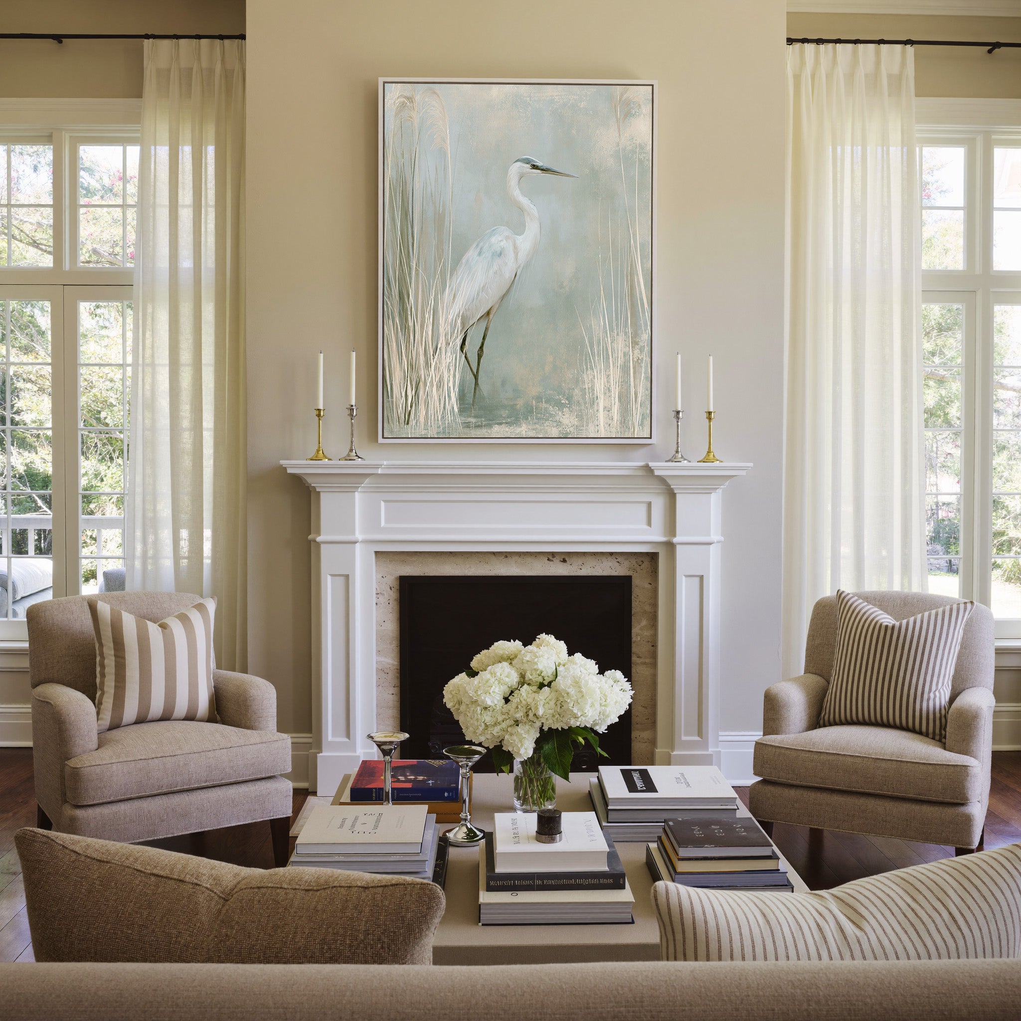 white heron among pale marsh reeds canvas wall art in a white frame above a mantel