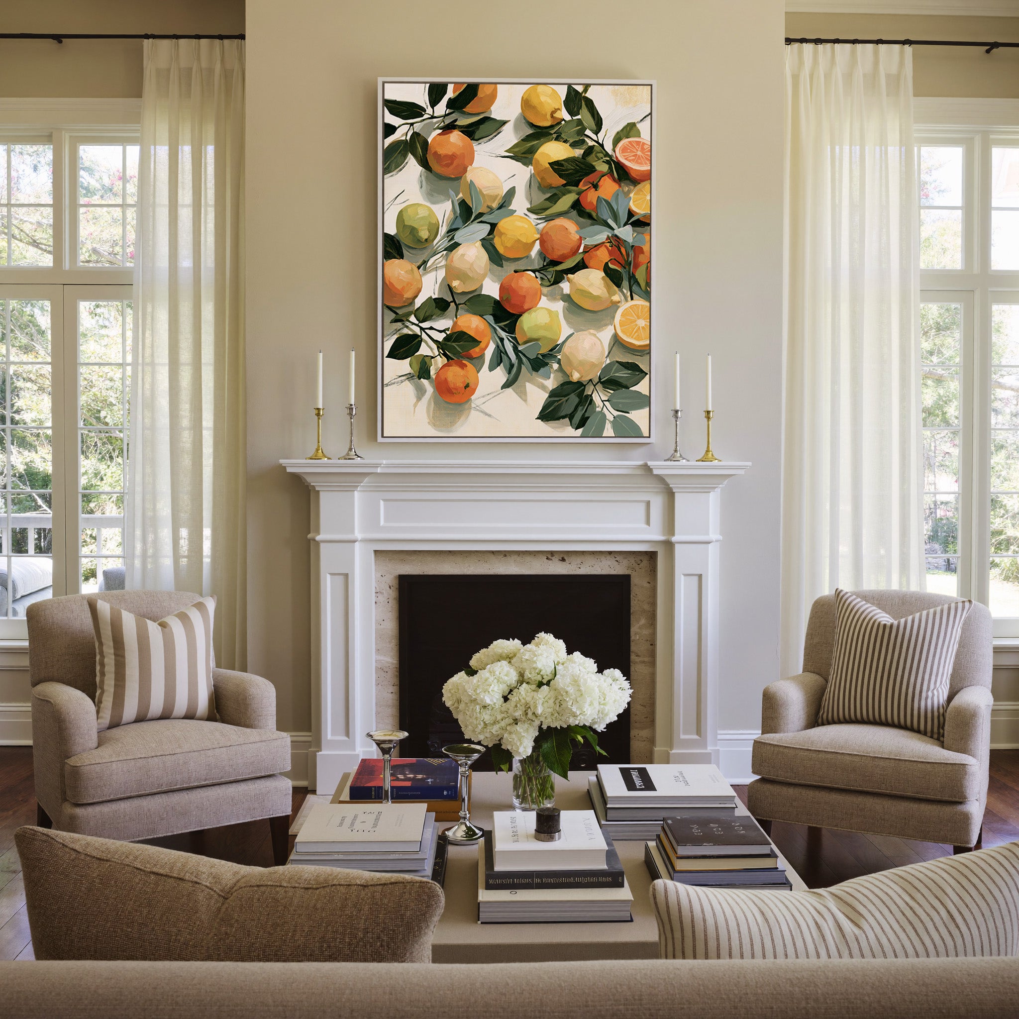 loose citrus still life with dark green leaves canvas wall art in a white frame above a mantel