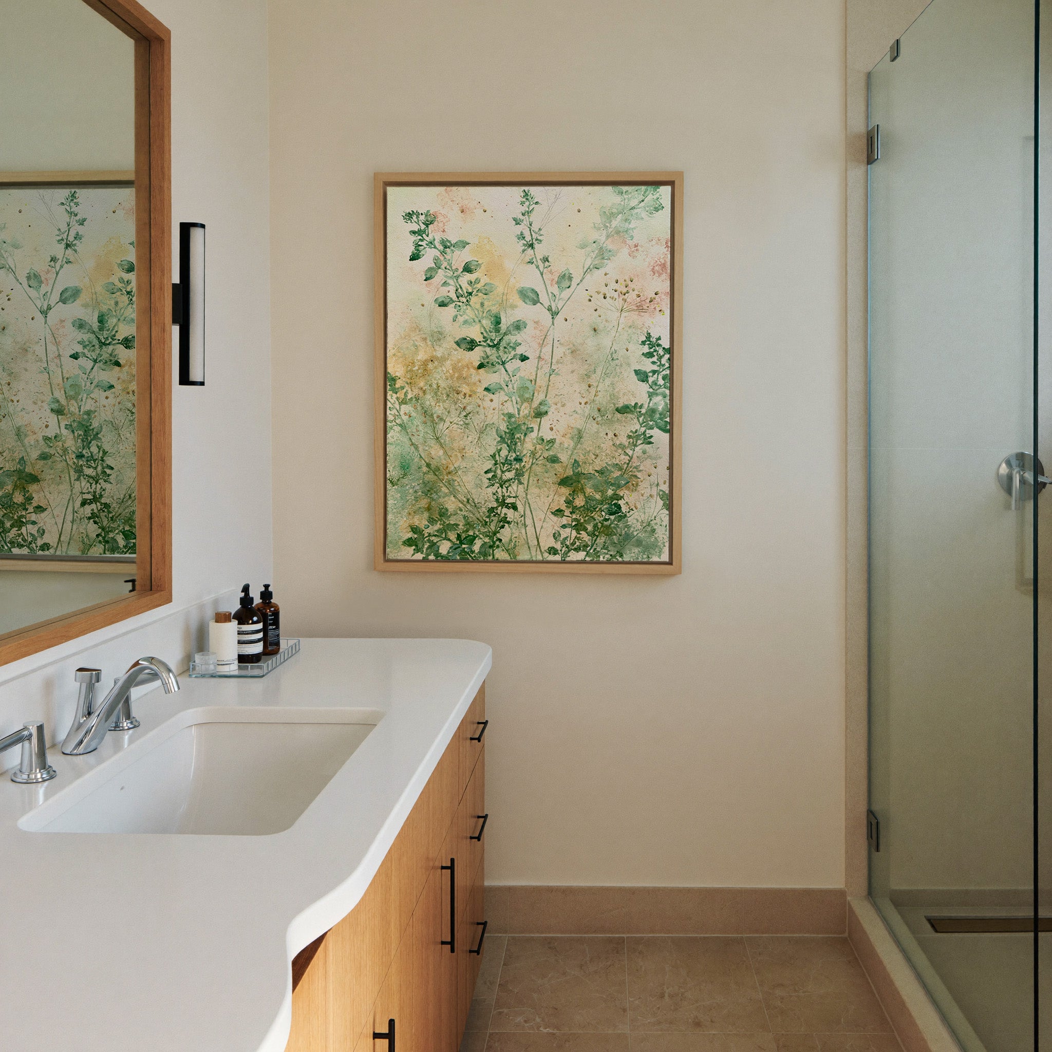loose herb like stems in sage, canvas wall art in a natural wood frame in a styled room setting