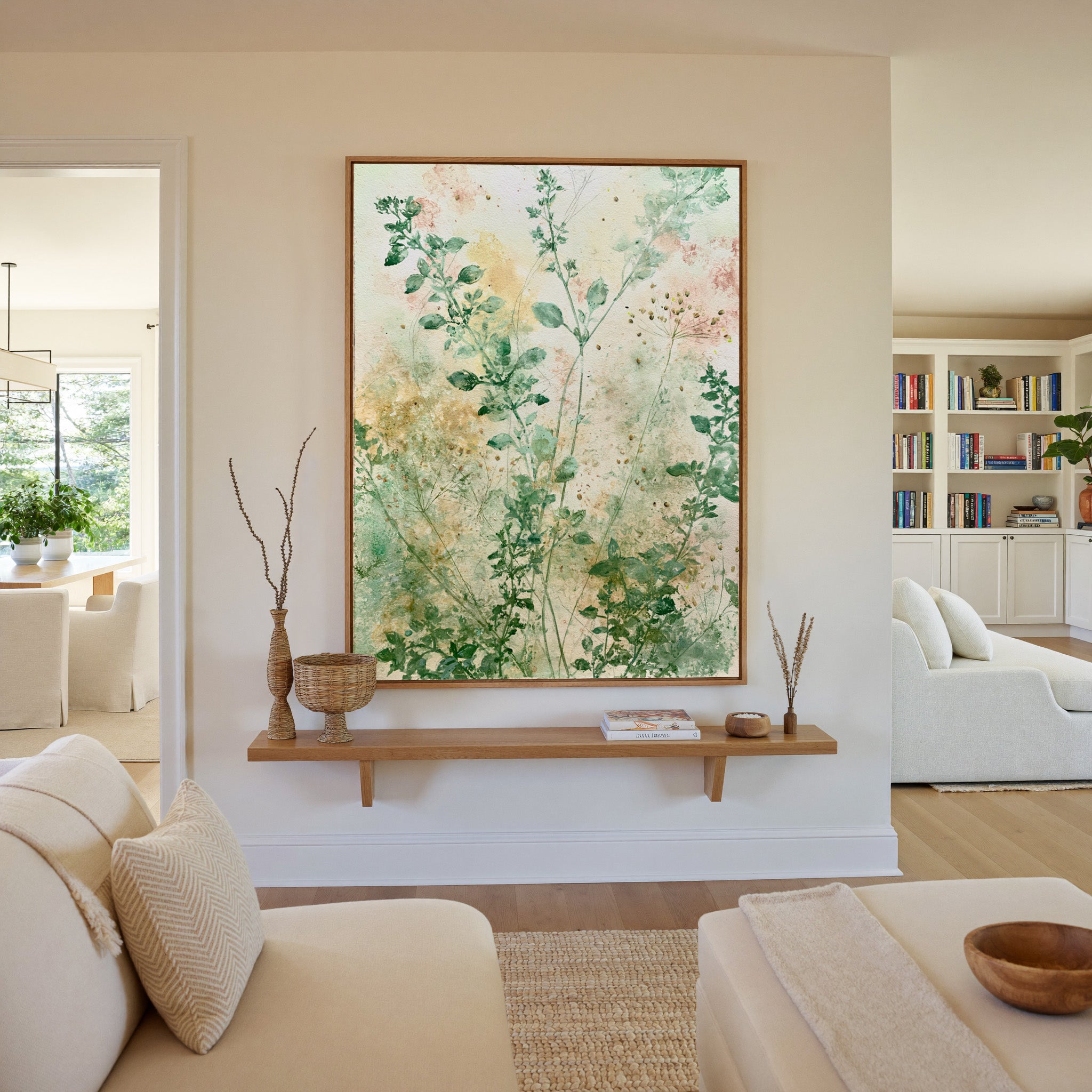 loose herb like stems in sage, cream, and blush canvas wall art in an oak frame in a living room