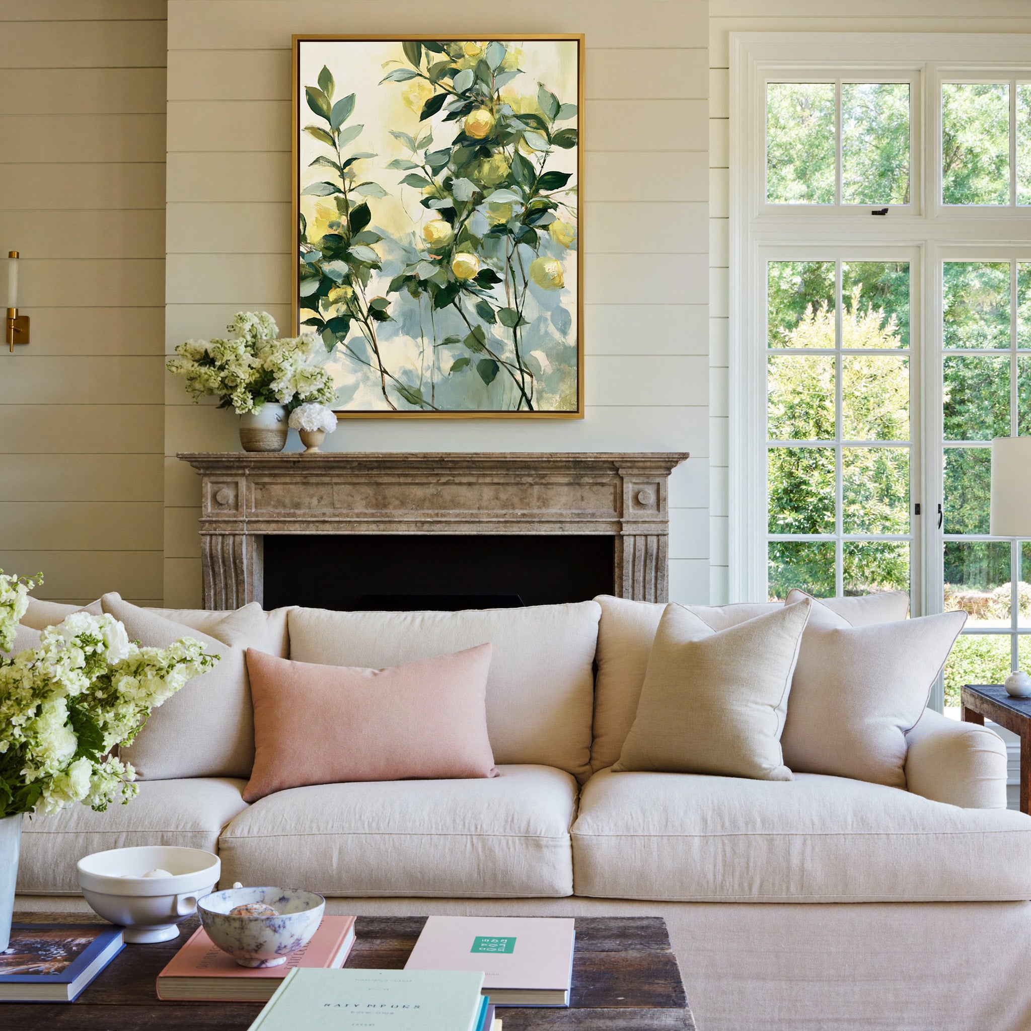 soft lemon and green botanical abstract canvas wall art in a gold frame above a mantel