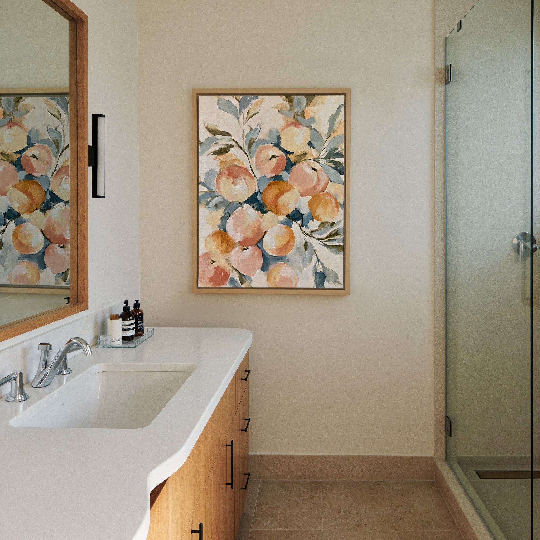 soft peaches and apricots with canvas wall art in a natural wood frame in a styled room setting