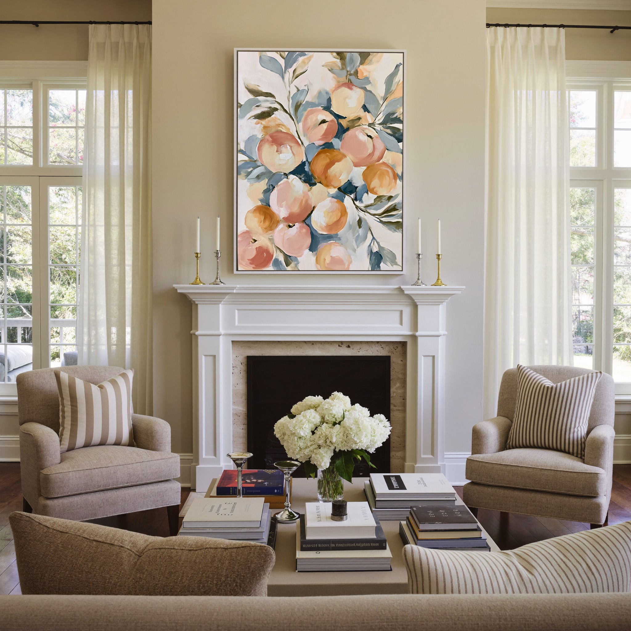 soft peaches and apricots with blue green leaves canvas wall art in a white frame above a mantel