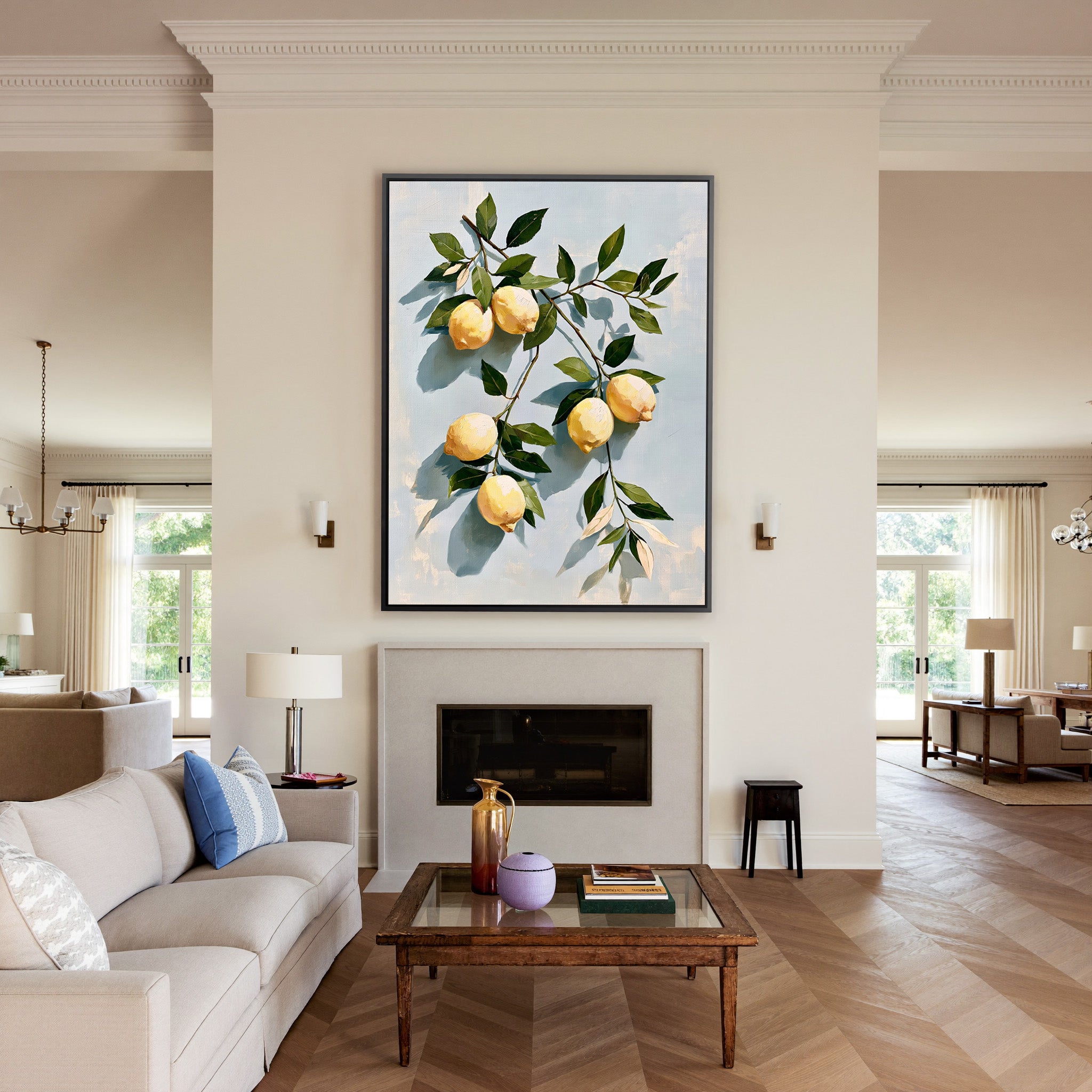 muted lemons with olive leaves on a pale blue canvas wall art in a black frame above a mantel