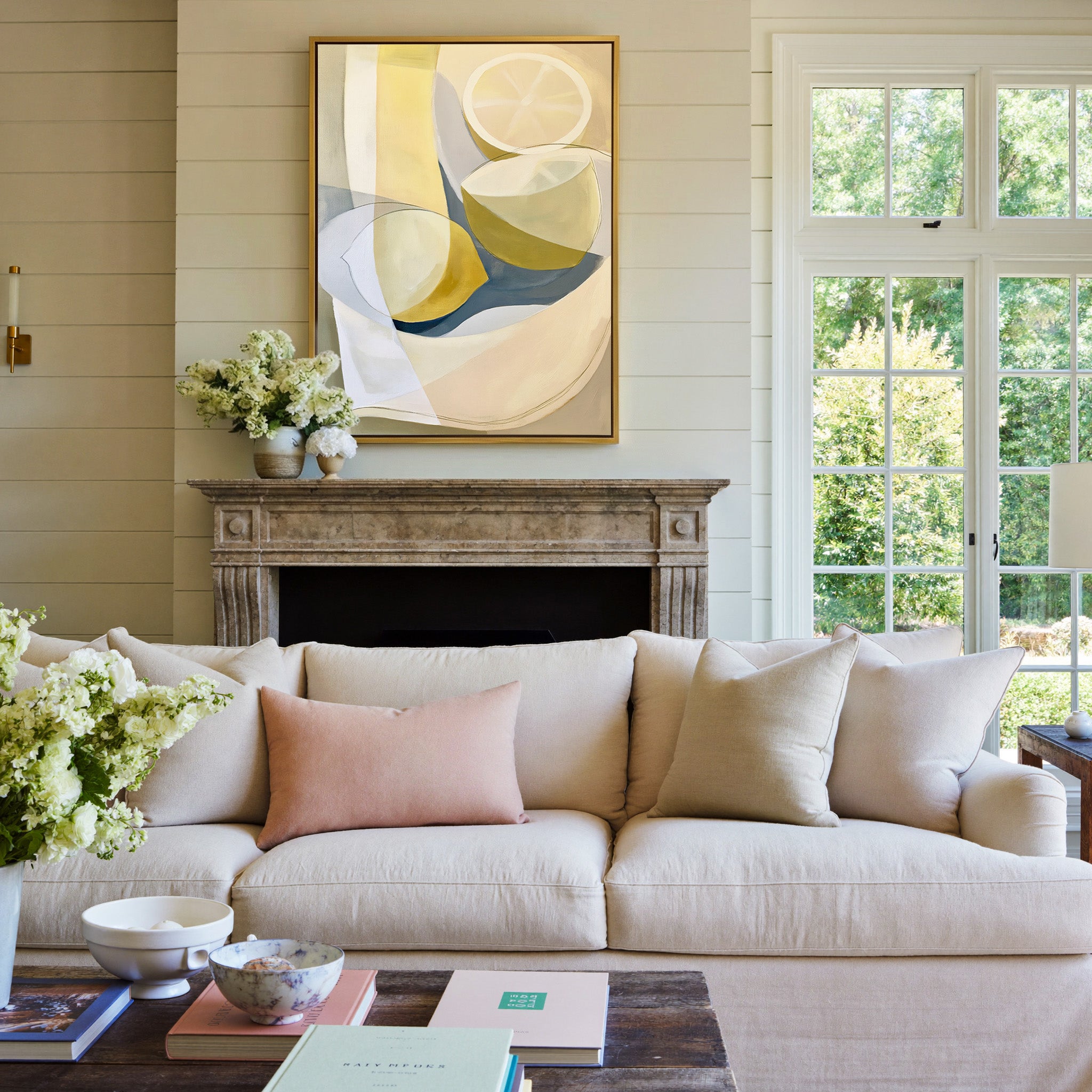 soft cream and yellow abstract still life canvas wall art in a gold frame above a mantel