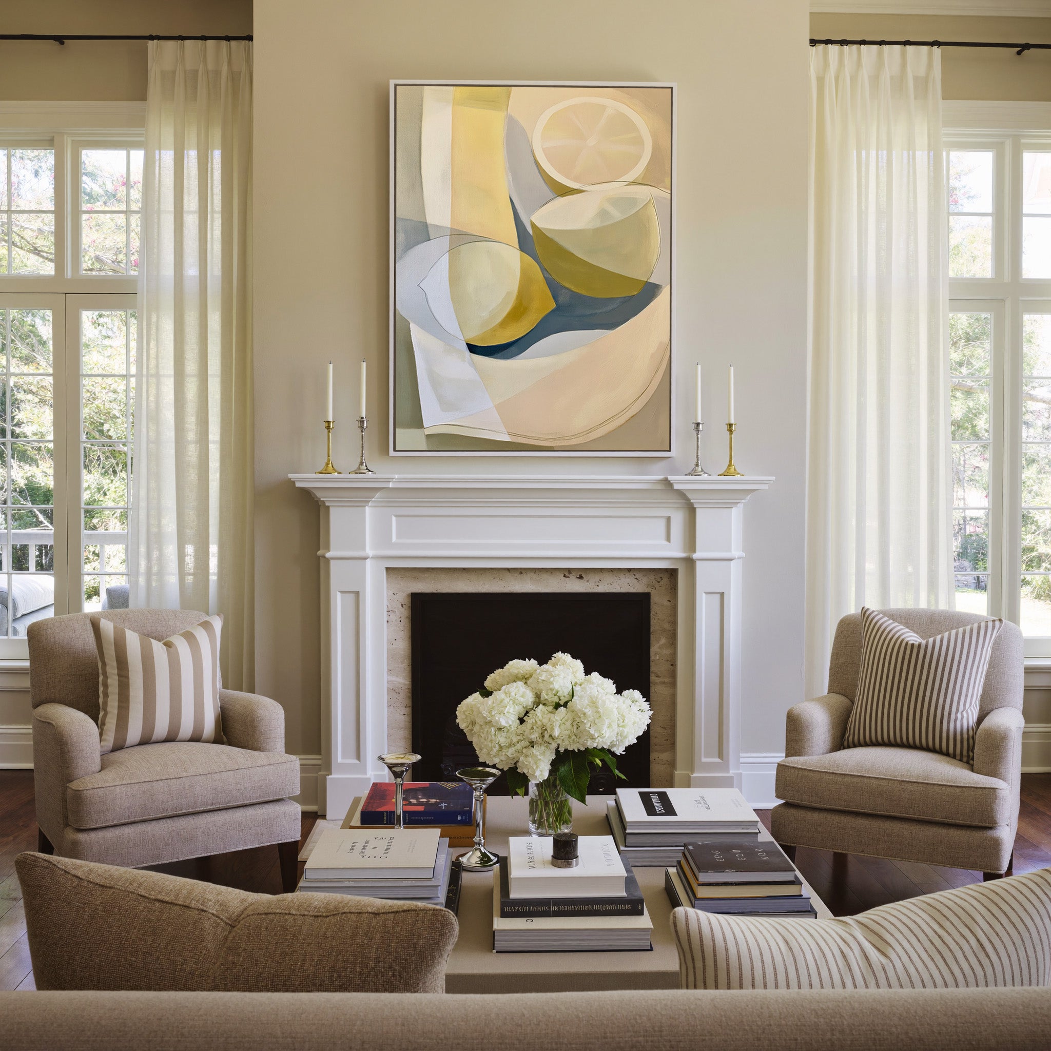 soft cream and yellow abstract still life canvas wall art in a white frame above a mantel