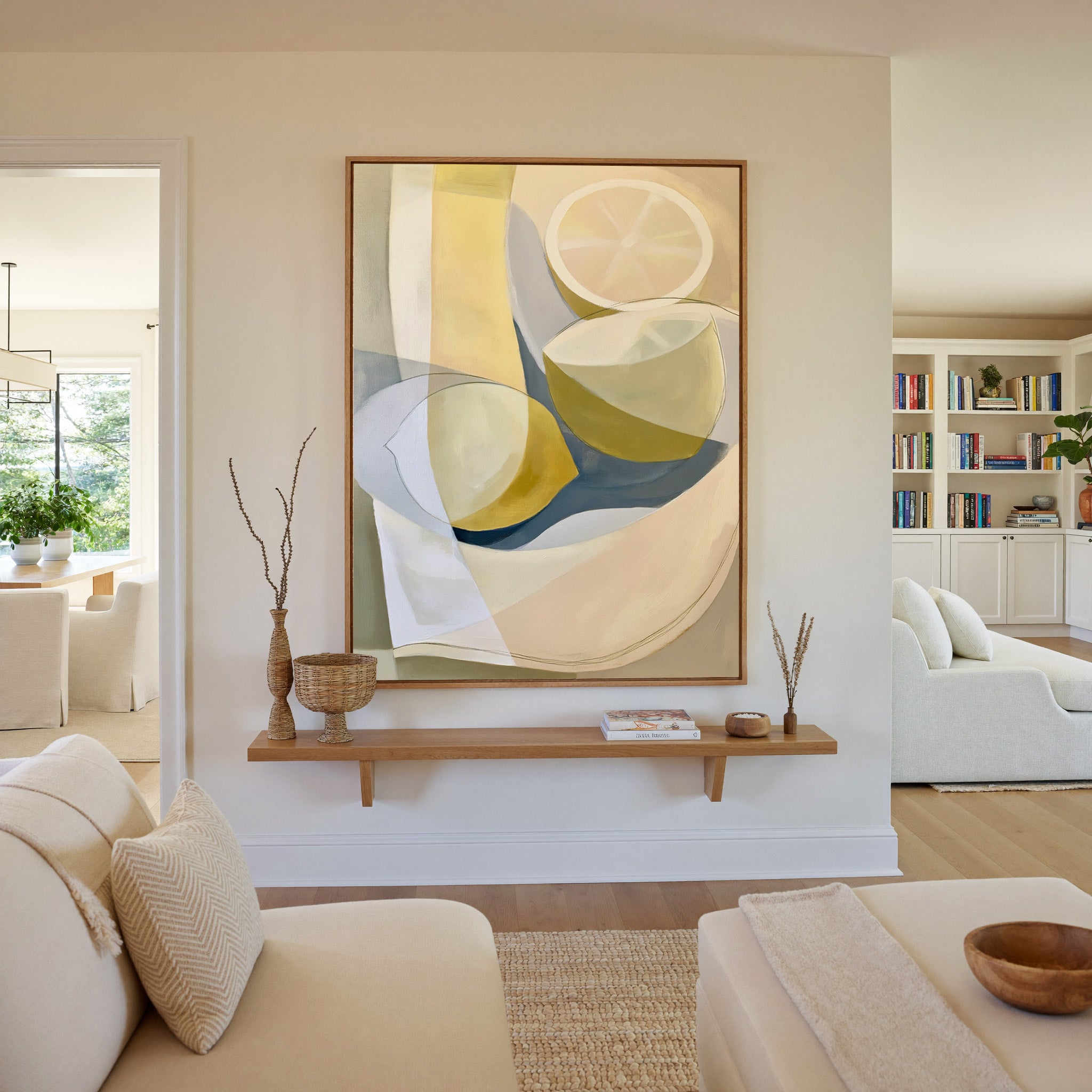 soft cream and yellow abstract still life canvas wall art in an oak frame in a living room