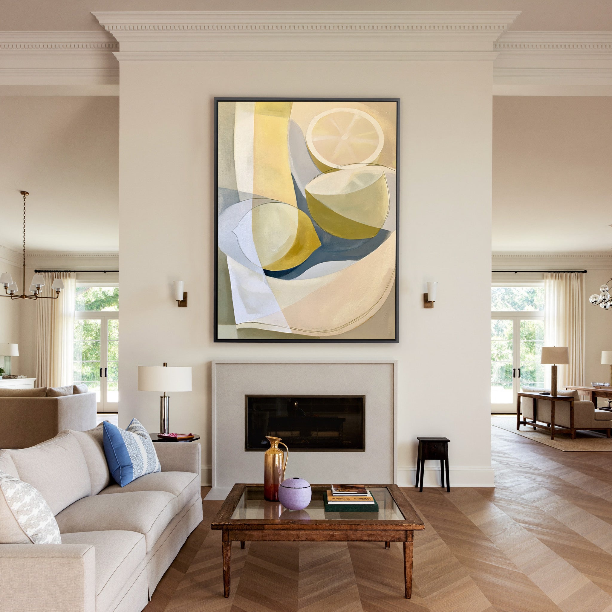 soft cream and yellow abstract still life canvas wall art in a black frame above a mantel