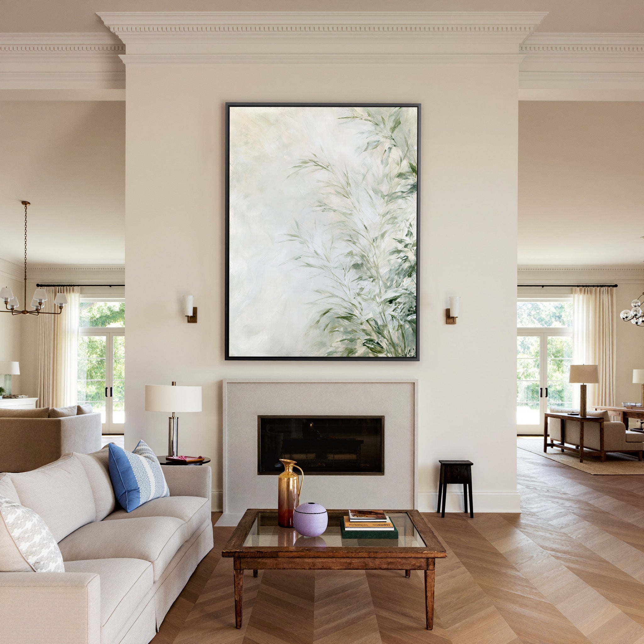 soft sage and cream botanical abstract canvas wall art in a black frame above a mantel