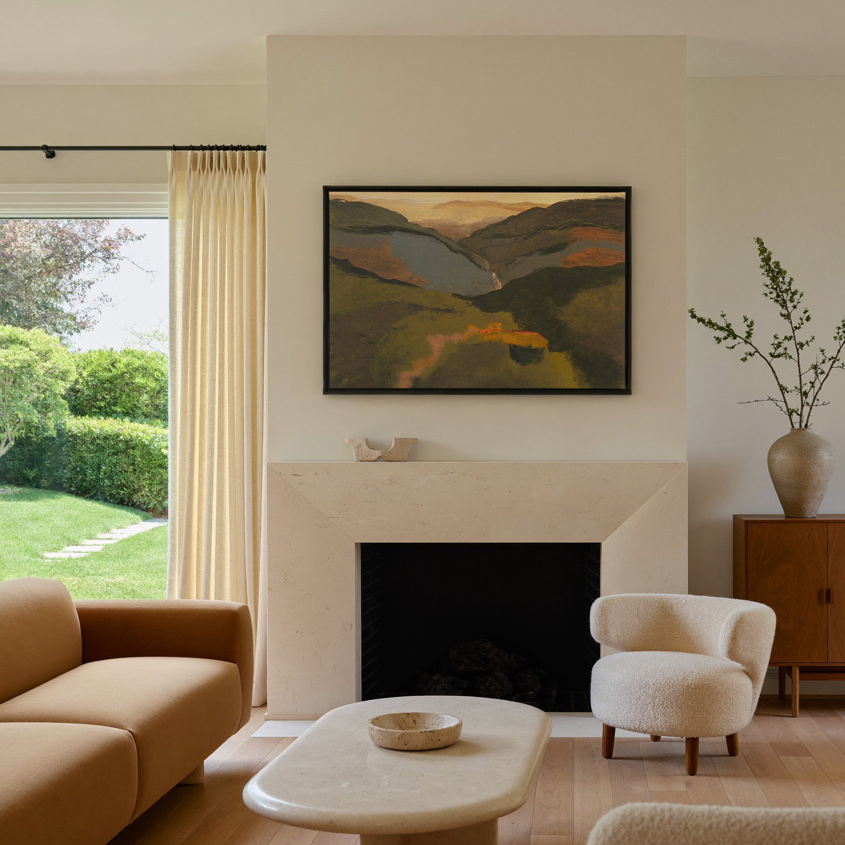 layered mountain valley at dusk canvas wall art in a black frame above a mantel