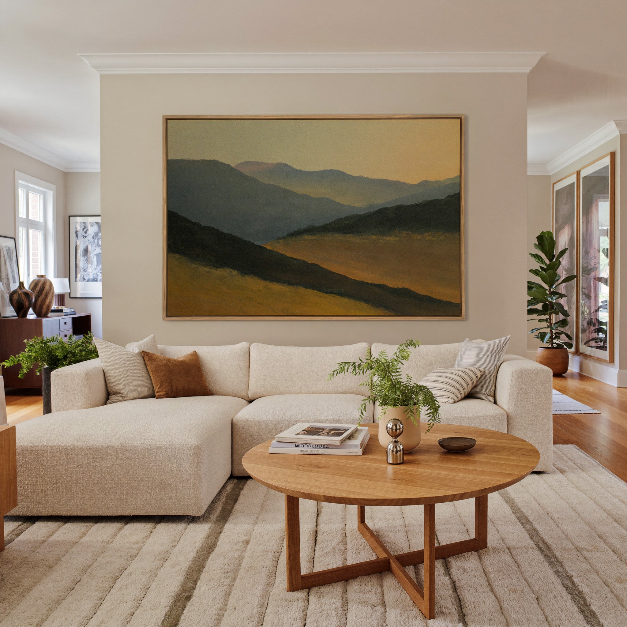 layered mountain ridges at sunset canvas wall art in an oak frame in a living room