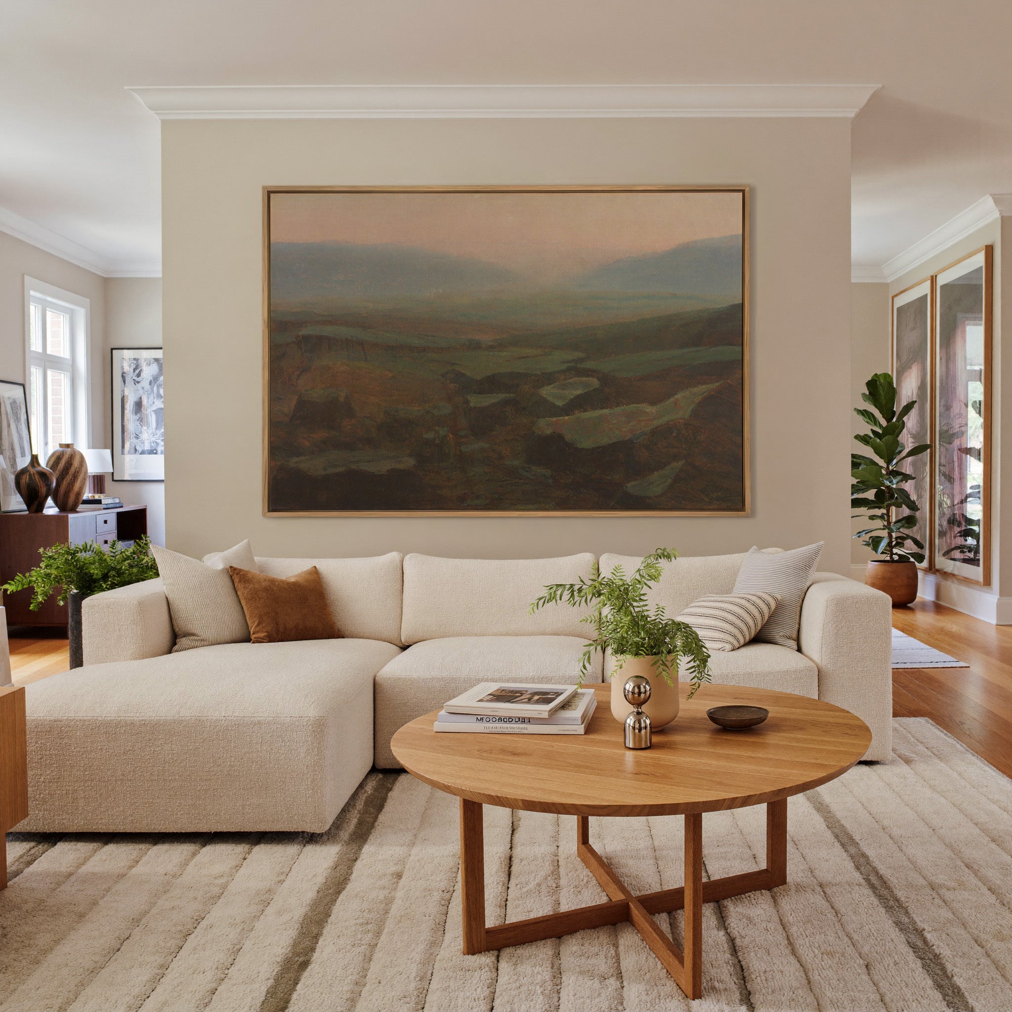 soft canyon landscape with layered mesas and a canvas wall art in an oak frame in a living room