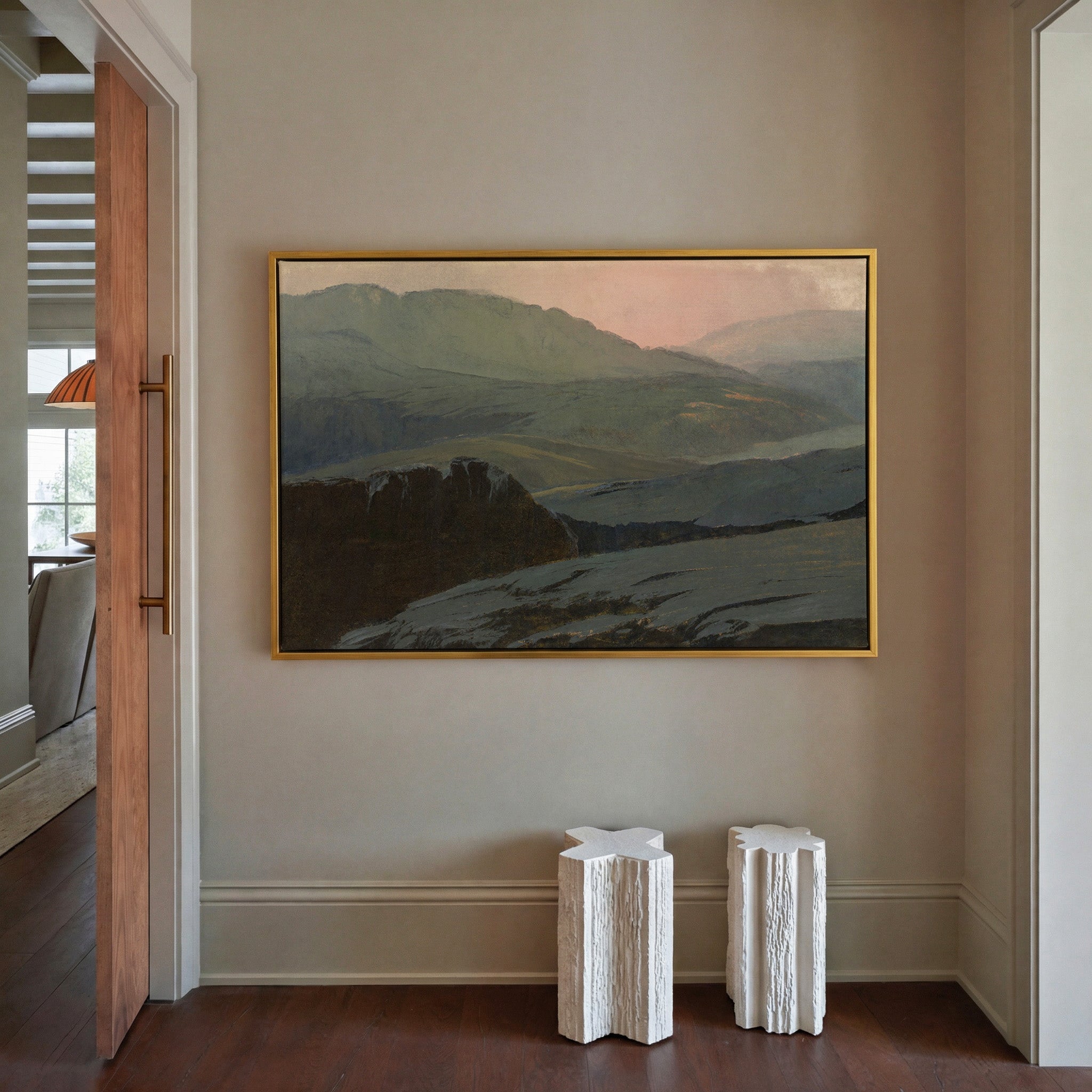 misty mountain landscape with dark foreground canvas wall art in a gold frame in a styled room setting