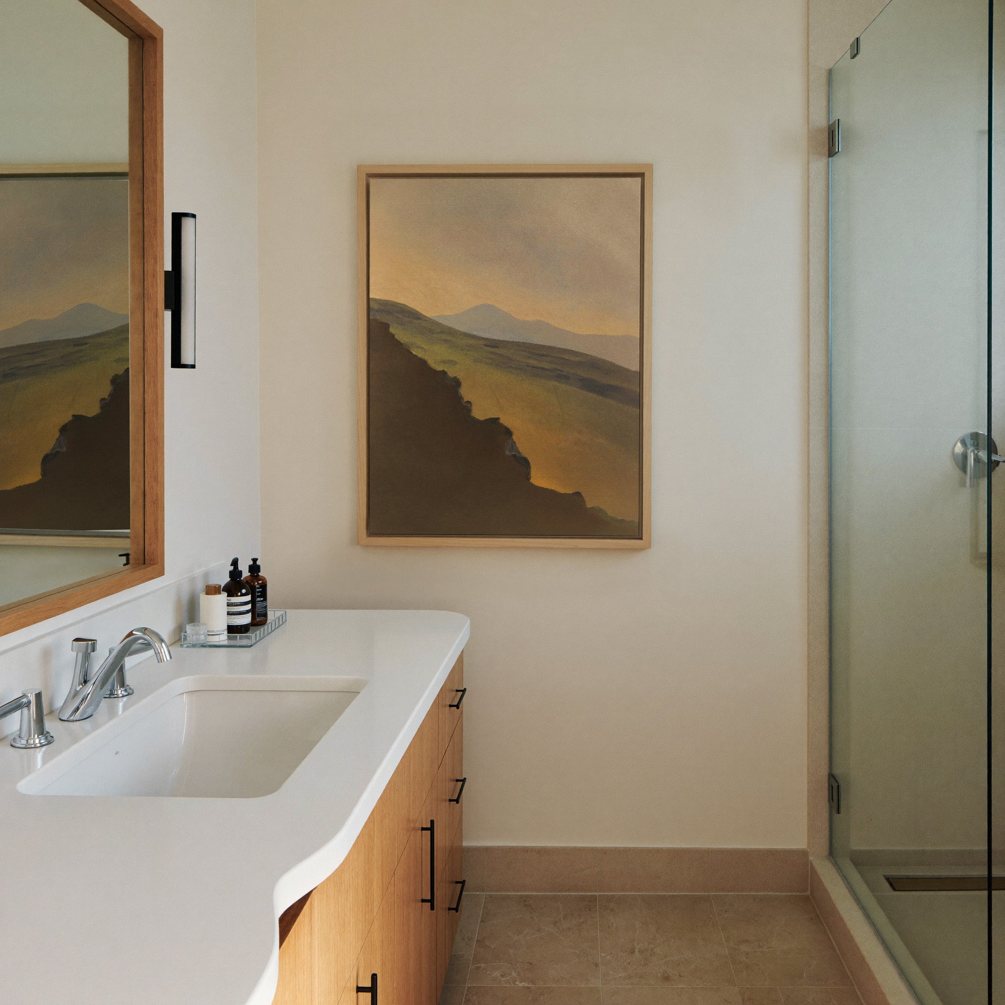 golden valley with dark foreground ridge canvas wall art in a natural wood frame in a styled room setting