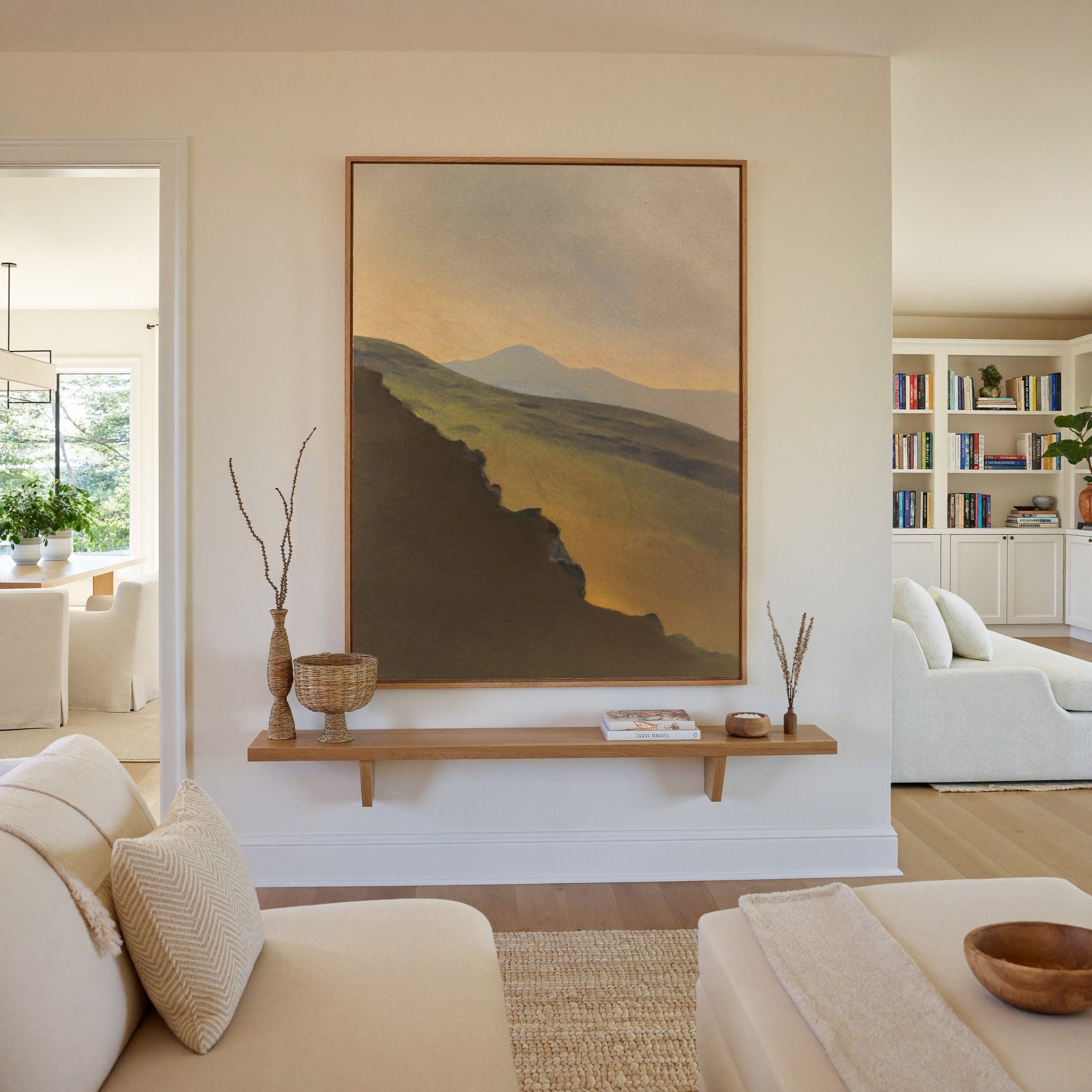 golden valley with dark foreground ridge canvas wall art in an oak frame in a living room