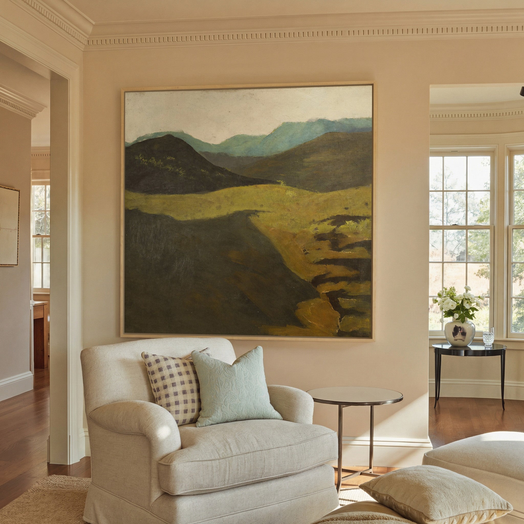 muted mountain landscape with dark foreground canvas wall art in a natural wood frame in a styled room setting