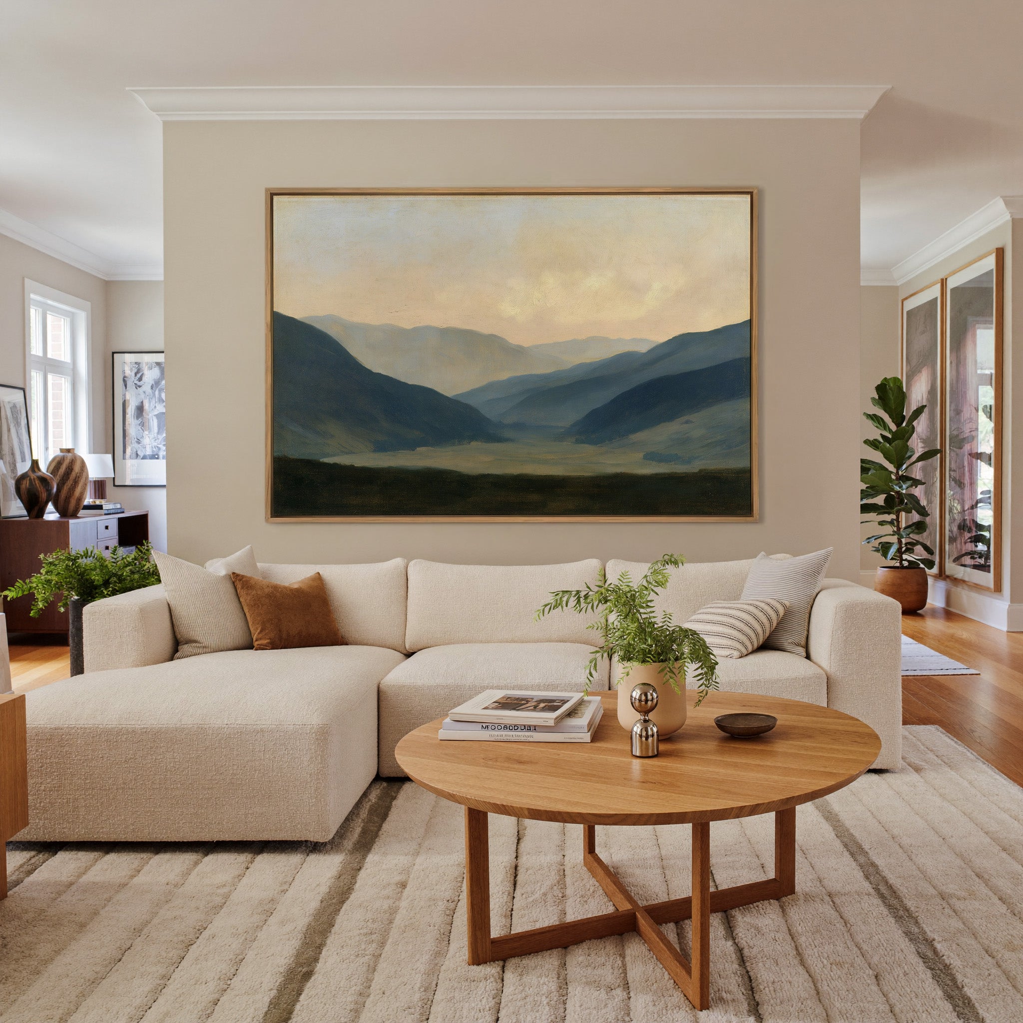 soft blue mountain valley at dawn canvas wall art in an oak frame in a living room