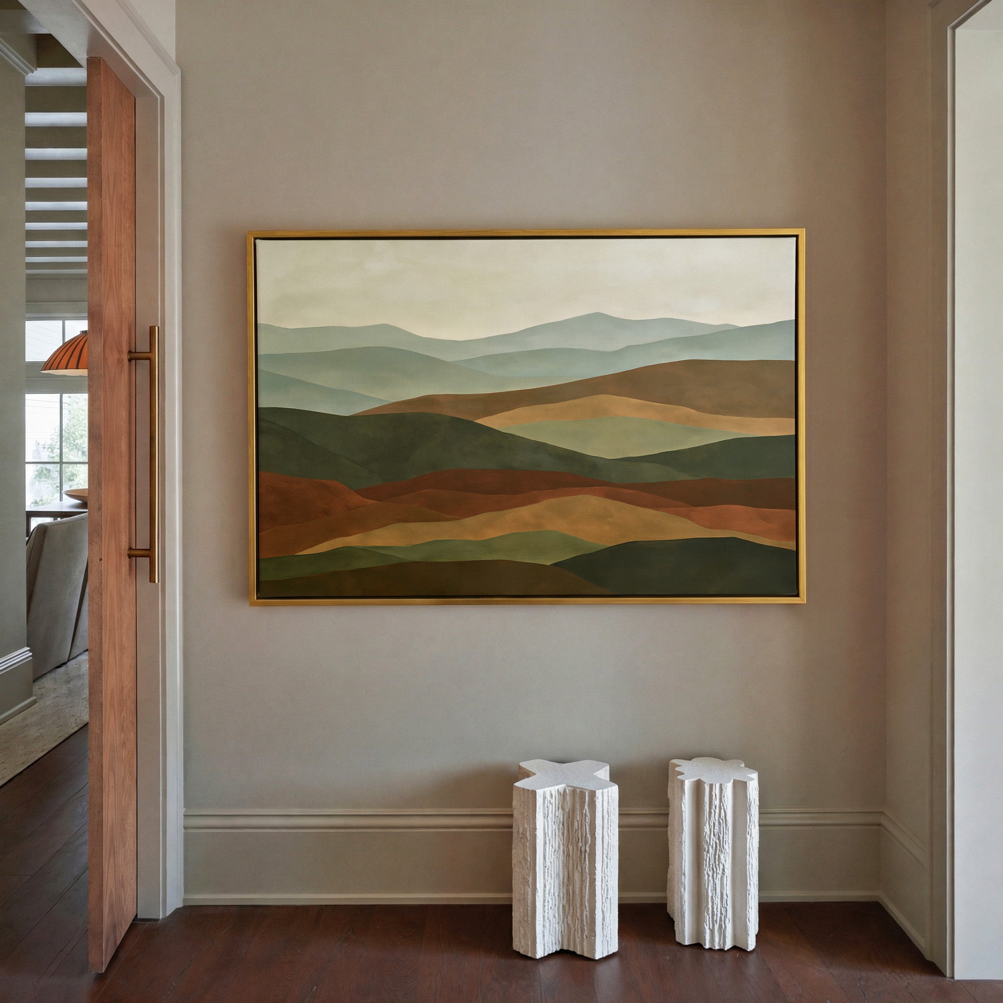 layered hills in sage, olive, rust, and tan canvas wall art in a gold frame in a styled room setting