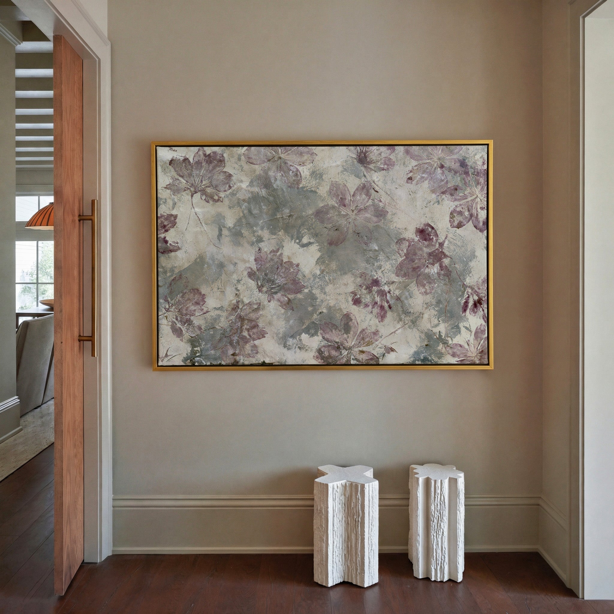 muted floral abstract with mauve blossoms on a canvas wall art in a gold frame in a styled room setting