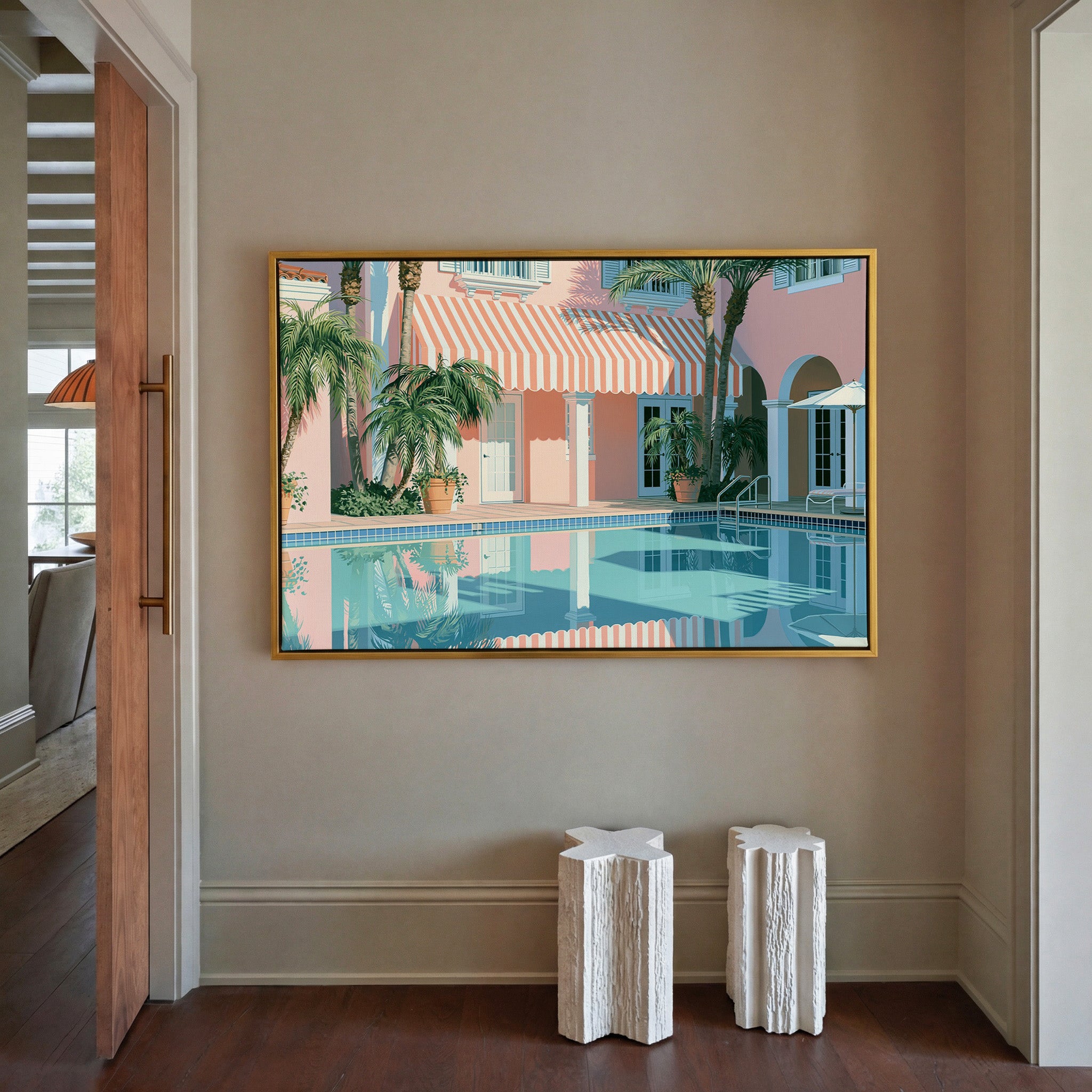 pastel courtyard with striped awning and palms canvas wall art in a gold frame in a styled room setting