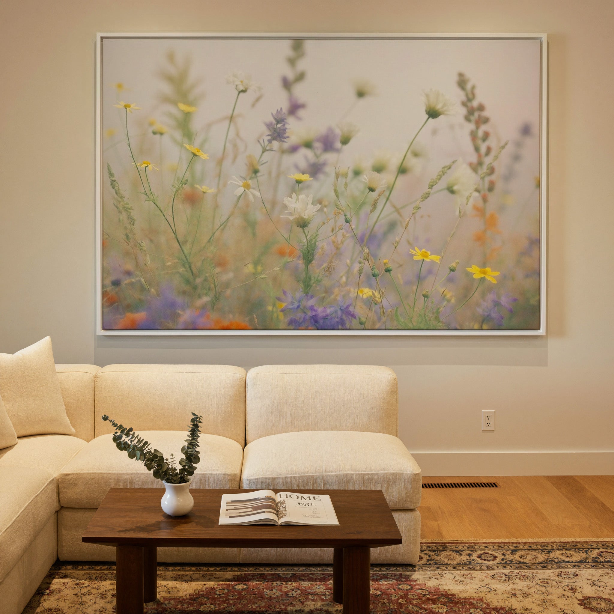 pastel wildflower field with yellow, white, and canvas wall art in a white frame in a styled room setting