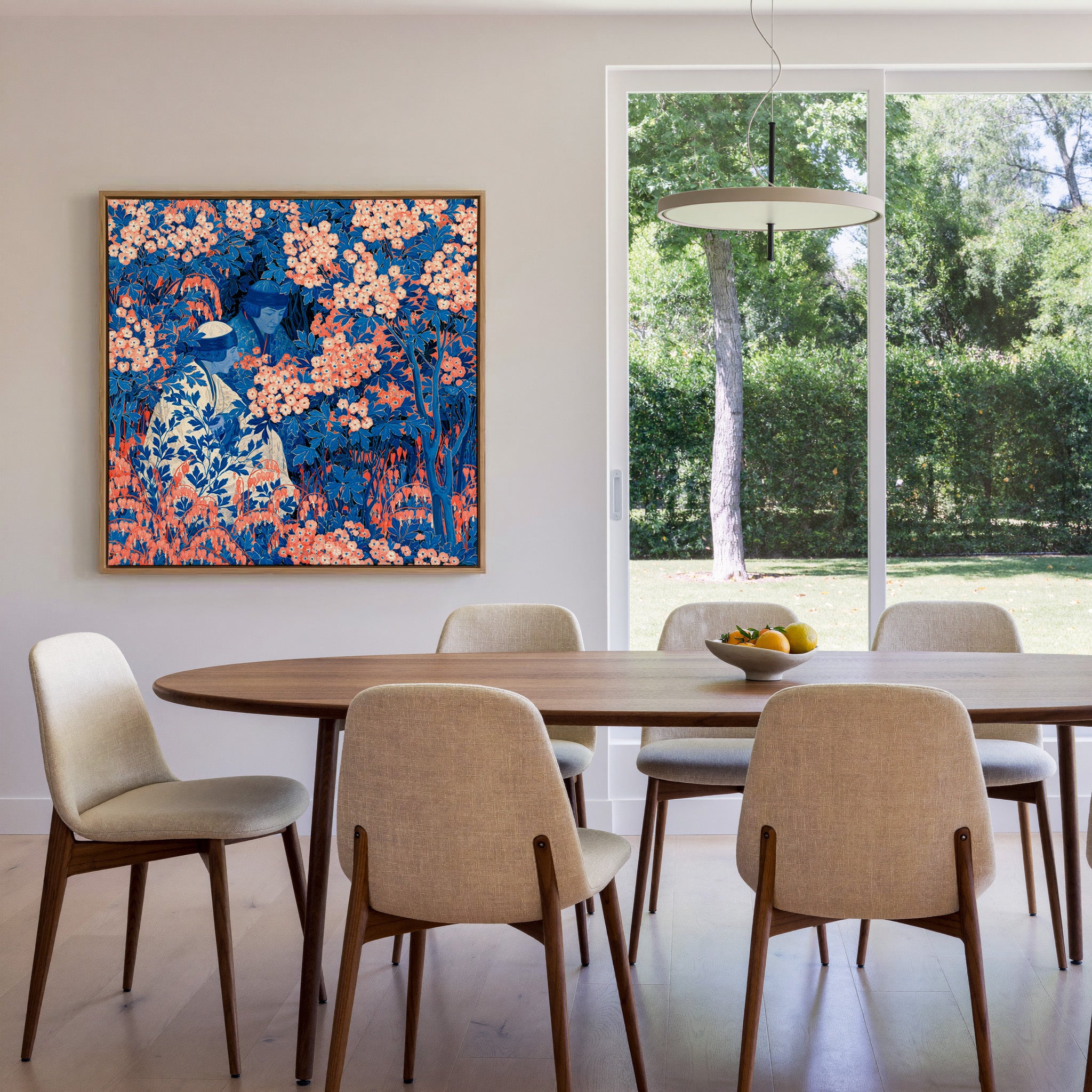 blue and coral garden scene with two seated canvas wall art in an oak frame in a dining room