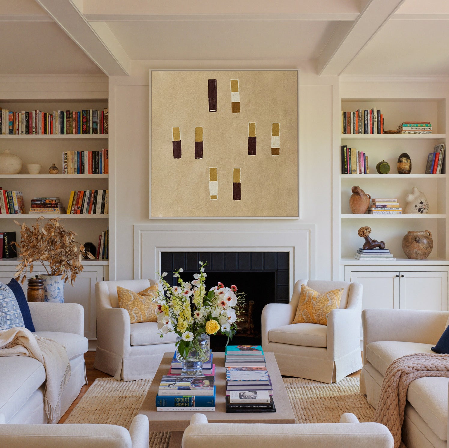 beige abstract with burgundy and ochre blocks canvas wall art in a white frame above a fireplace