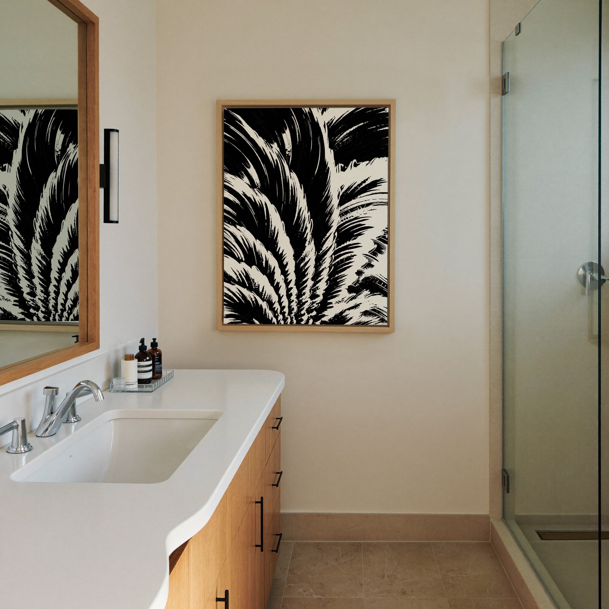 black and white palm leaf abstract canvas wall art in a natural wood frame in a styled room setting