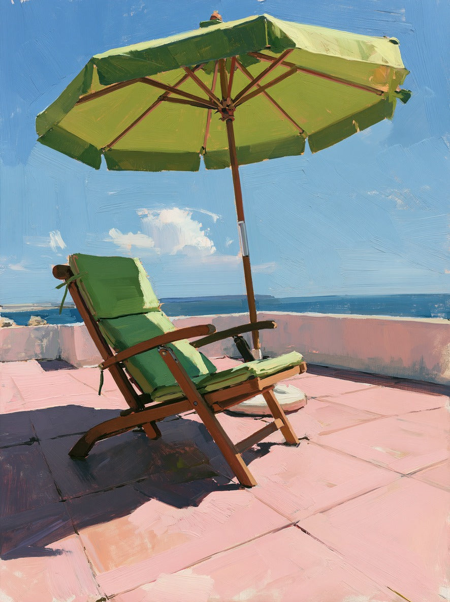 Green umbrella and lounge chair on pink terrace tiles with blue sky and sea beyond