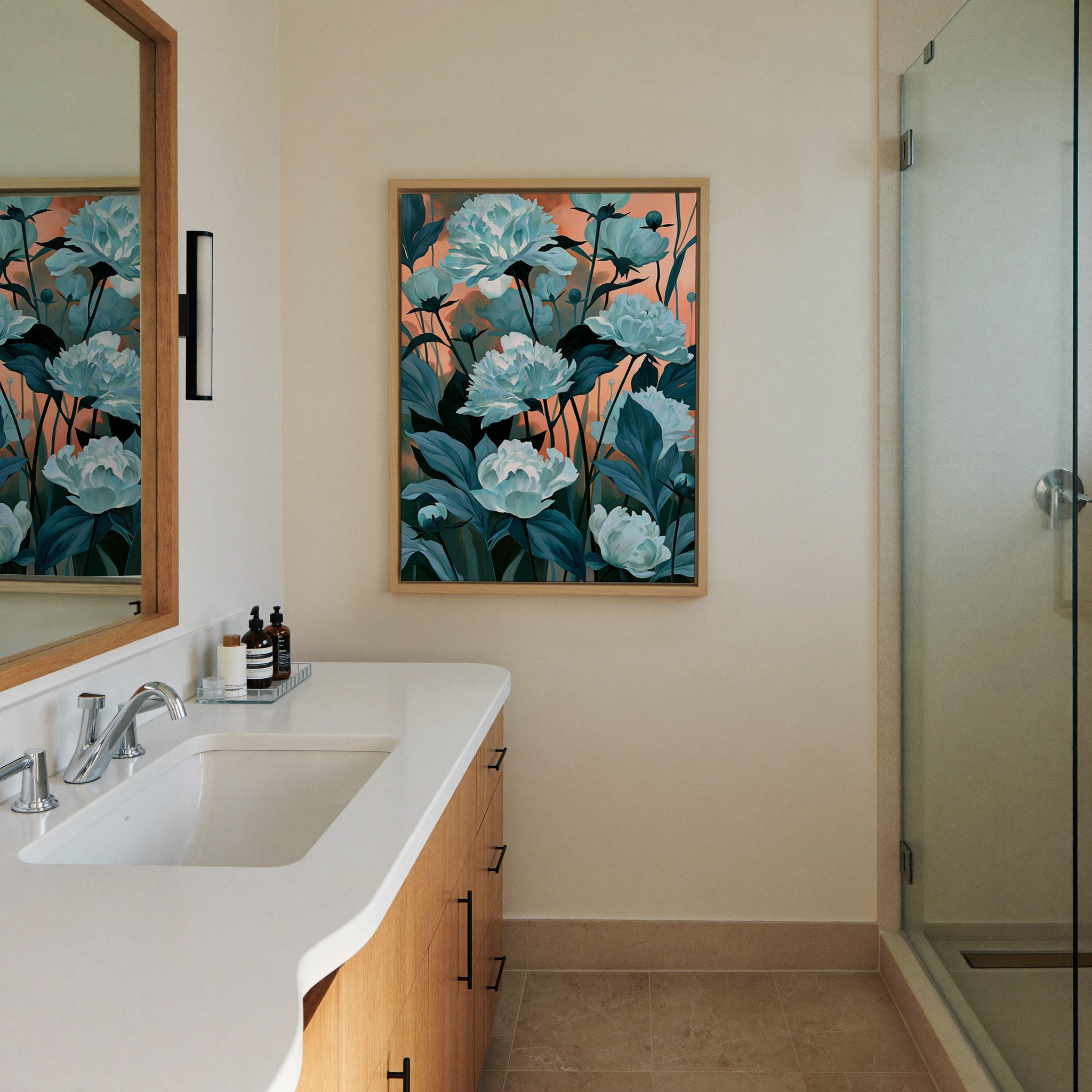 white flowers with teal leaves on canvas wall art in a natural wood frame in a styled room setting