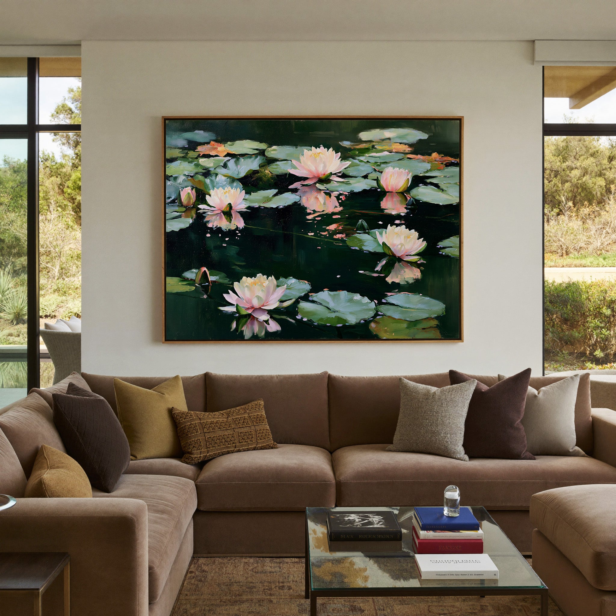 pink and white water lilies on dark green water canvas wall art in an oak frame in a styled room setting