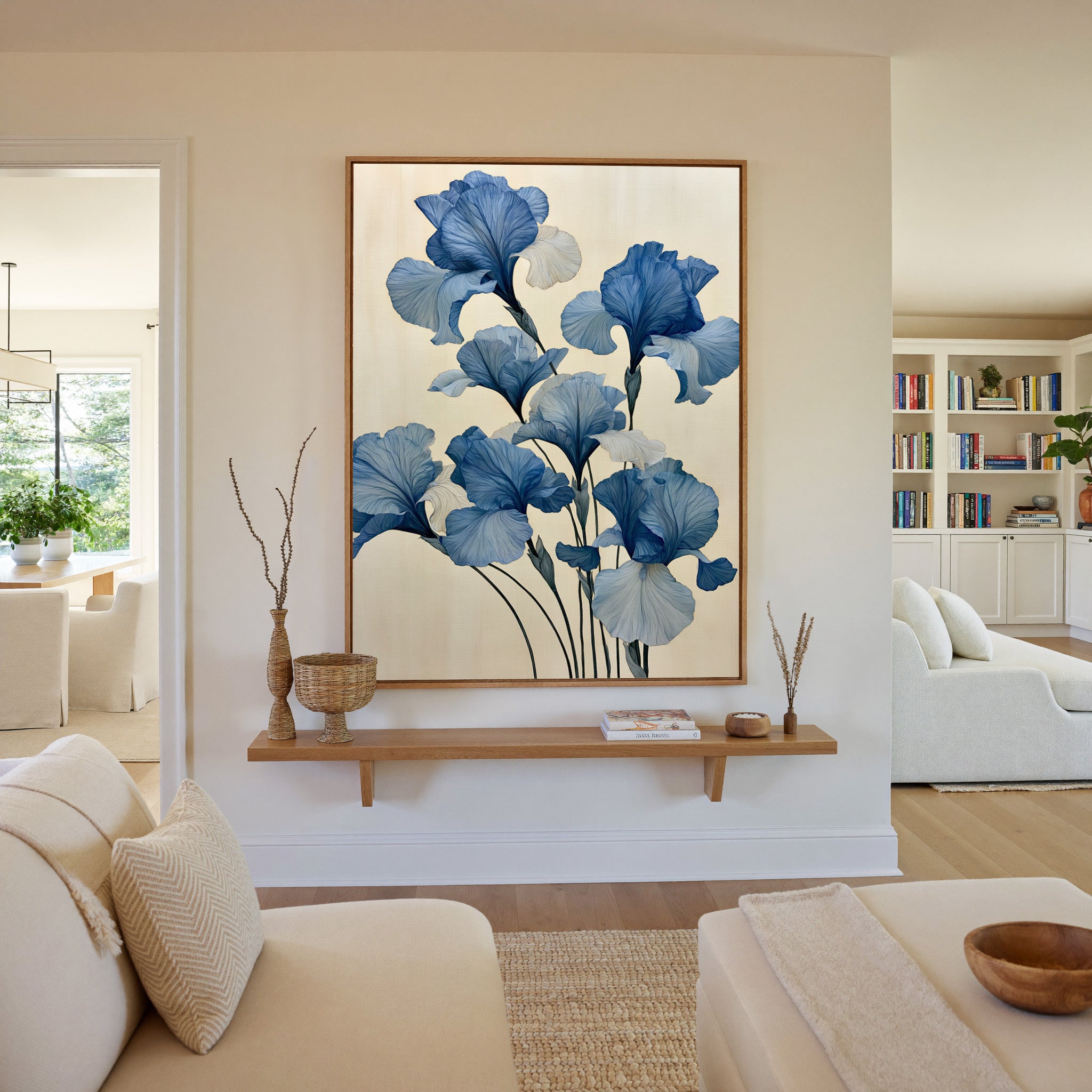 oversized blue iris flowers on a pale cream canvas wall art in an oak frame in a living room
