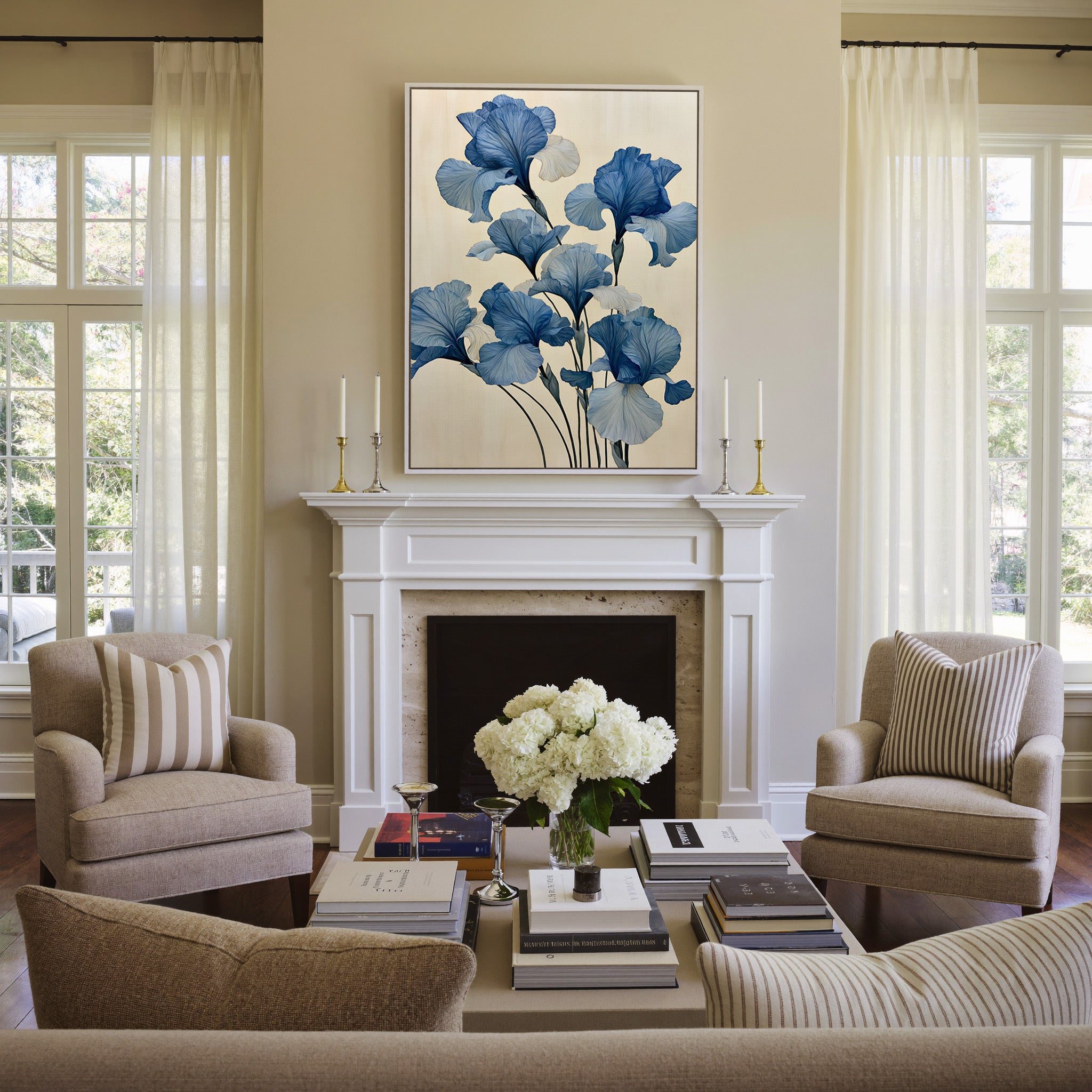 oversized blue iris flowers on a pale cream canvas wall art in a white frame above a mantel