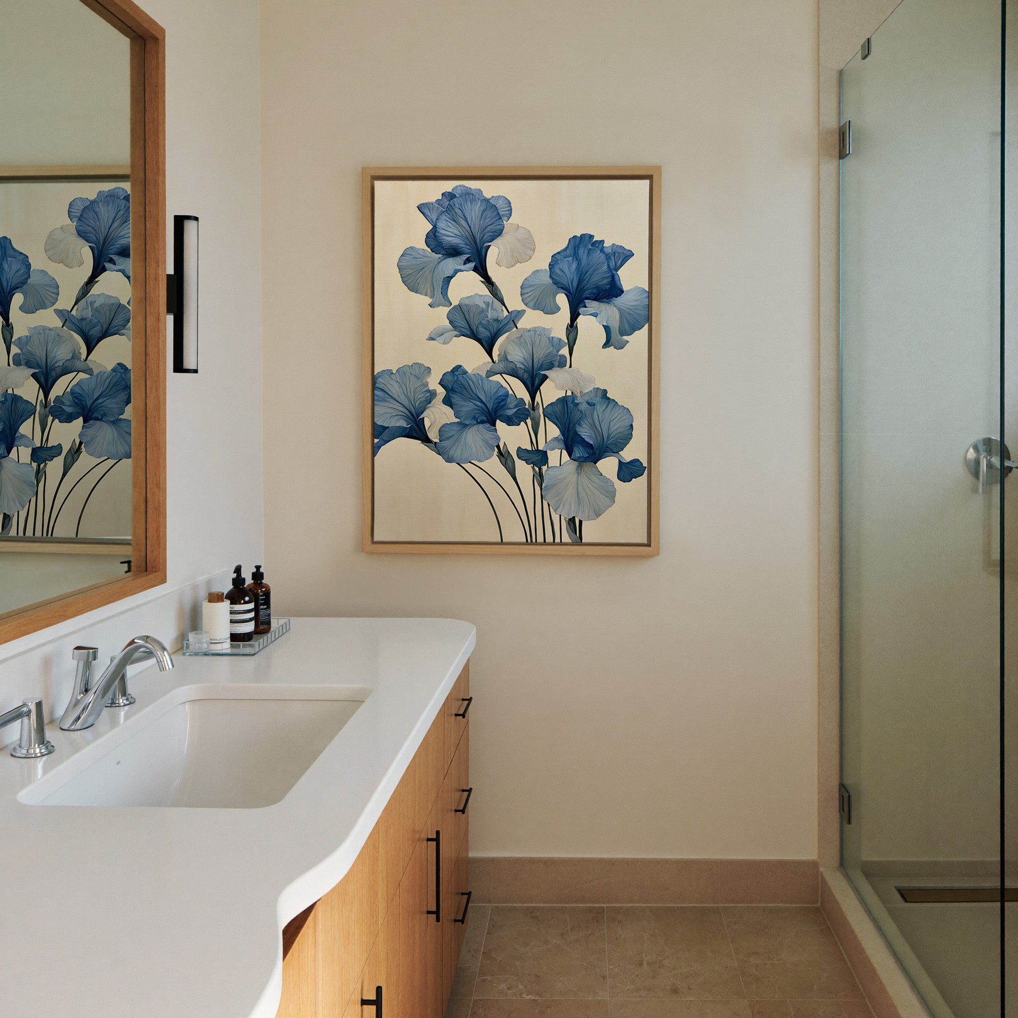 oversized blue iris flowers on a pale cream canvas wall art in a natural wood frame in a styled room setting
