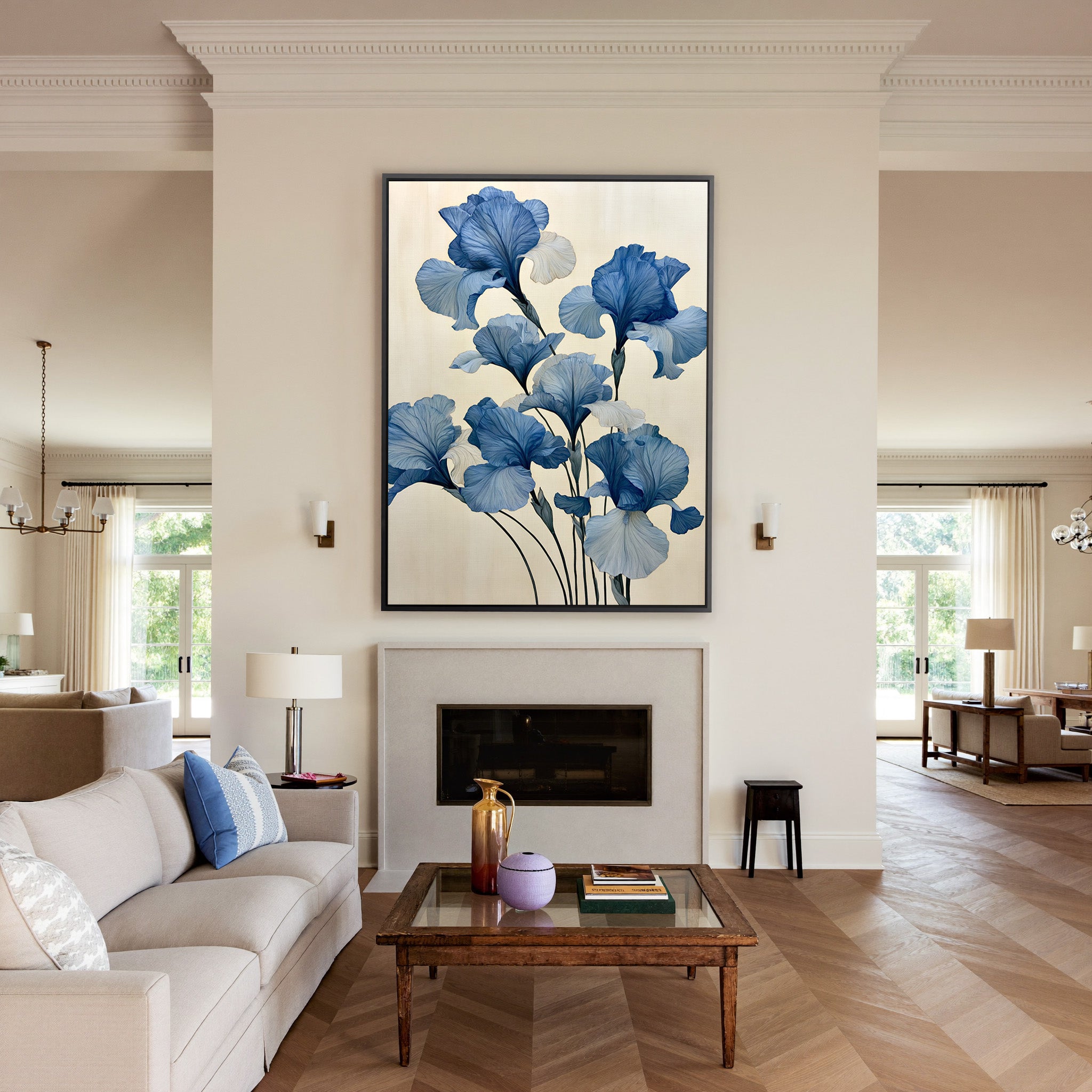 oversized blue iris flowers on a pale cream canvas wall art in a black frame above a mantel