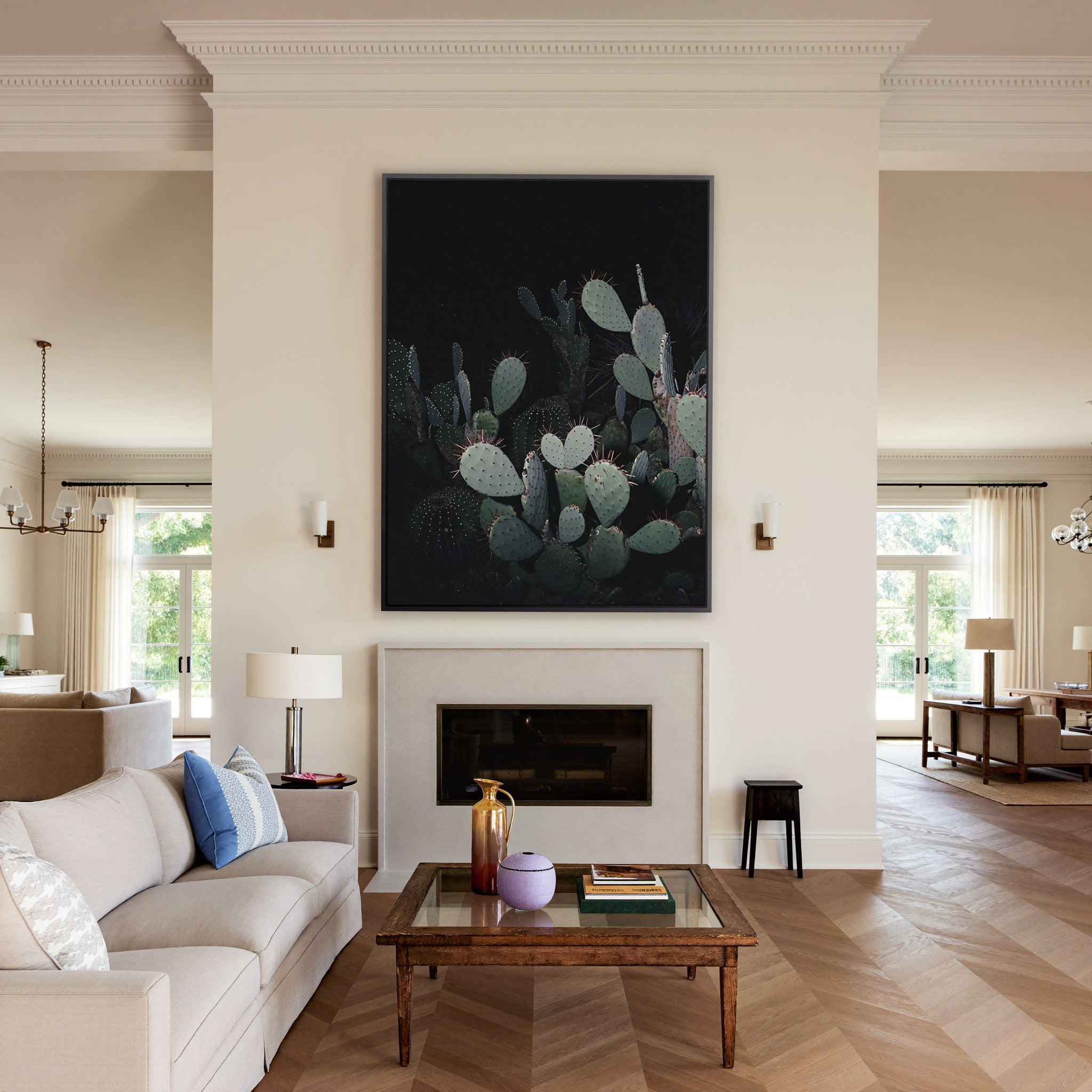dark prickly pear cactus with pale pads canvas wall art in a black frame above a mantel