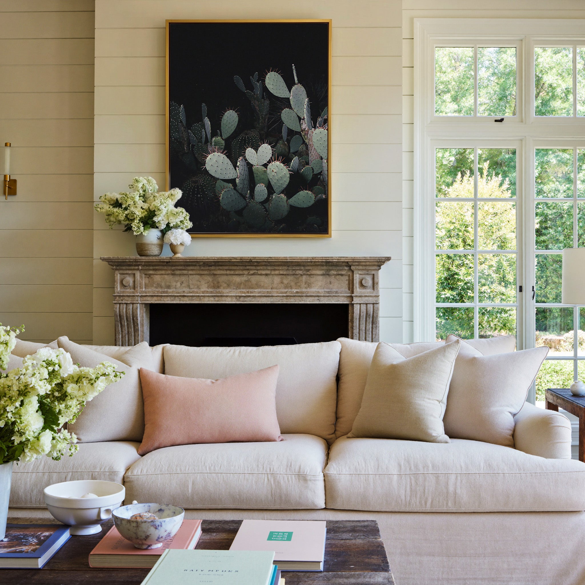 dark prickly pear cactus with pale pads canvas wall art in a gold frame above a mantel