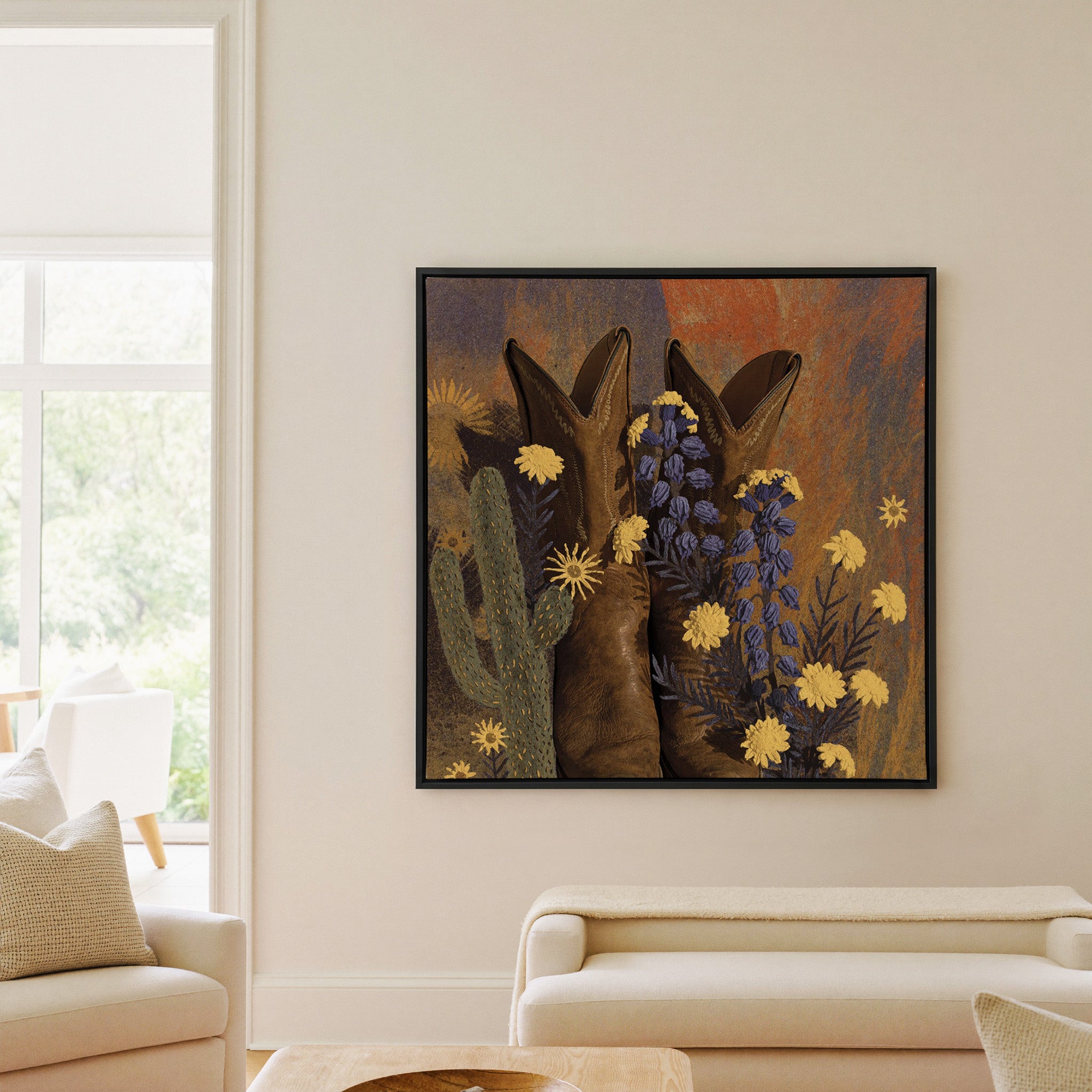 brown boots with yellow and blue wildflowers canvas wall art in a black frame in a living room