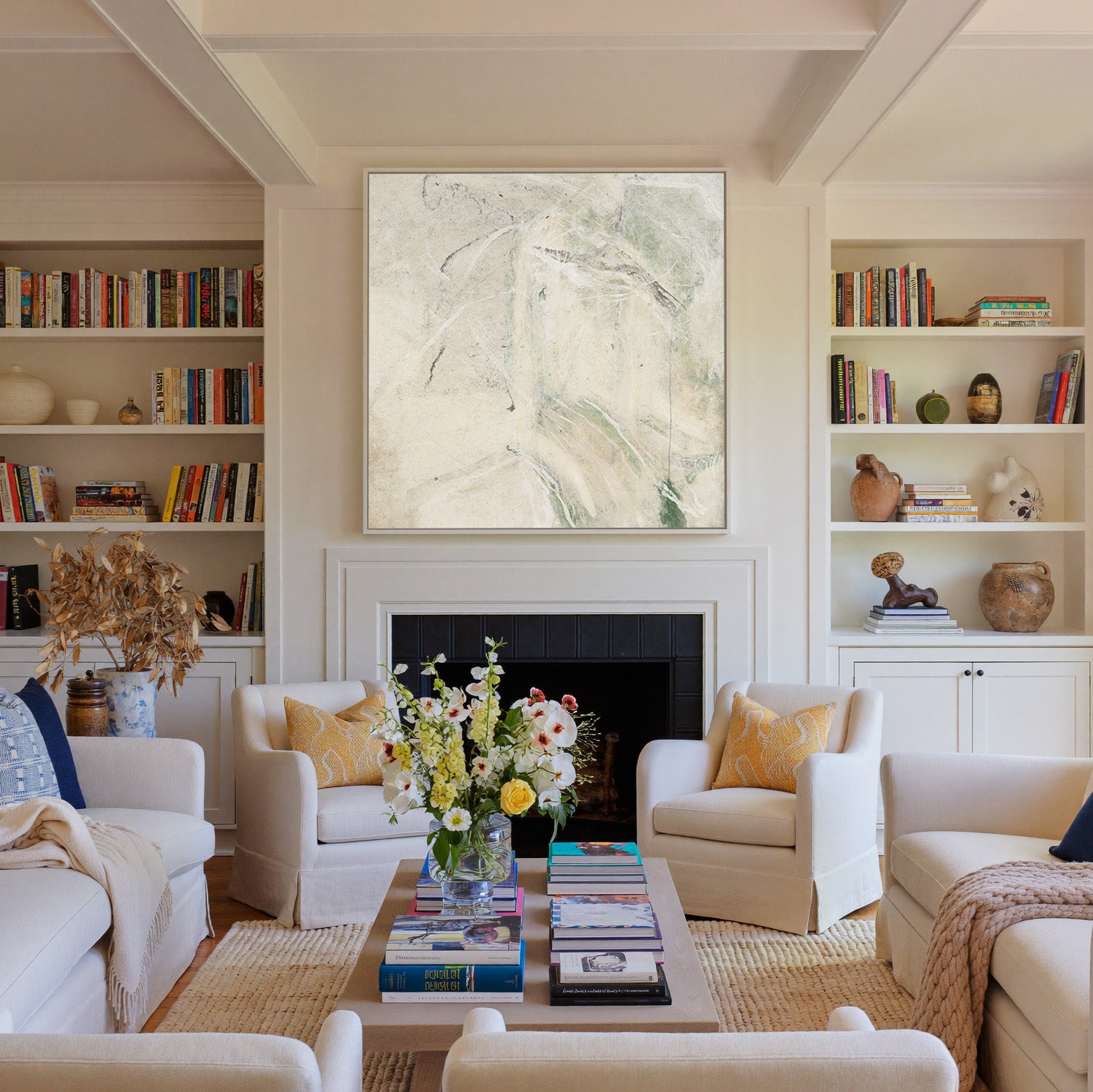 soft cream abstract with pale green sweeps and canvas wall art in a white frame above a fireplace