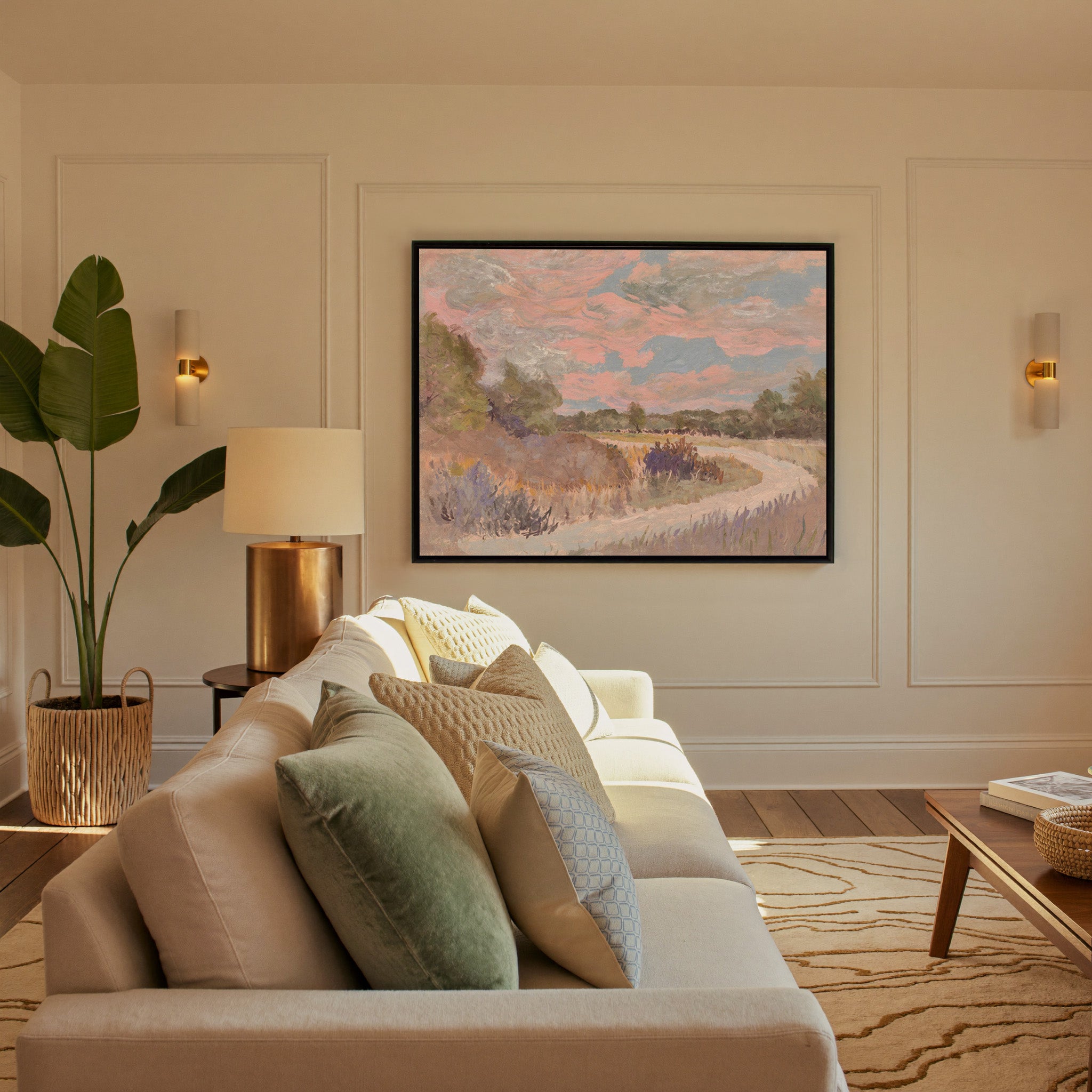 pastel meadow path with pink sky and lavender canvas wall art in a black frame in a styled room setting