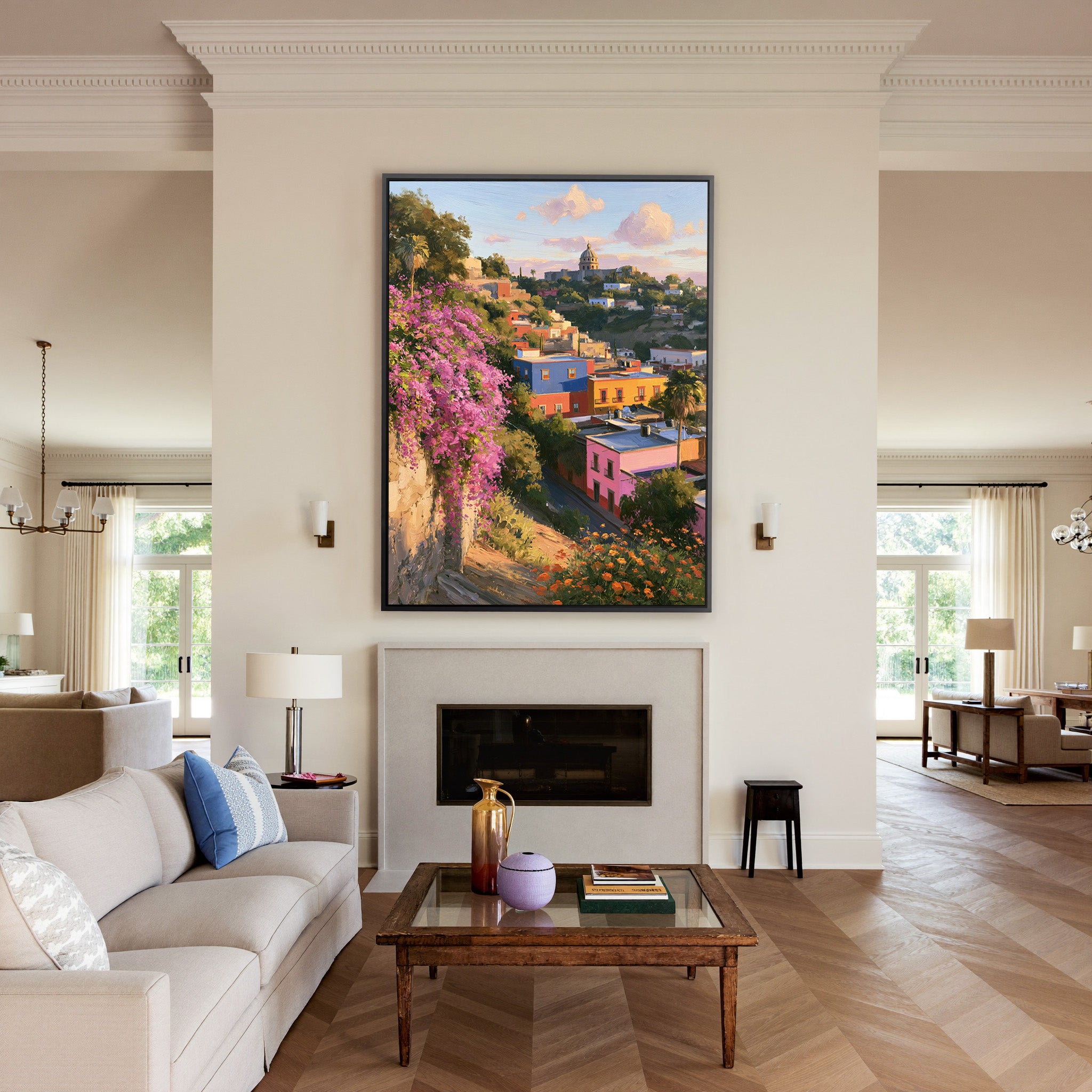 colorful hillside town with a domed church and canvas wall art in a black frame above a mantel