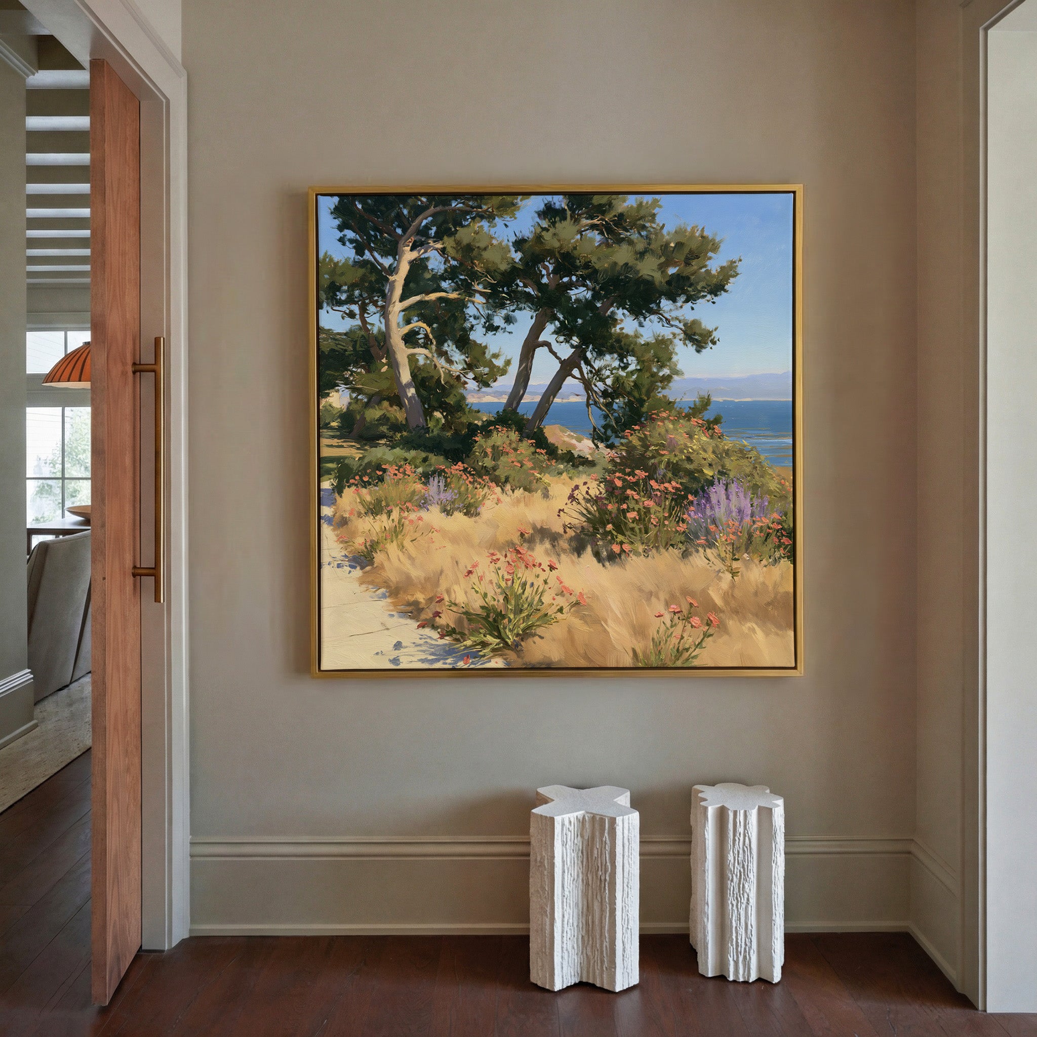 coastal garden with wind shaped cypress, dry canvas wall art in a gold frame in a styled room setting