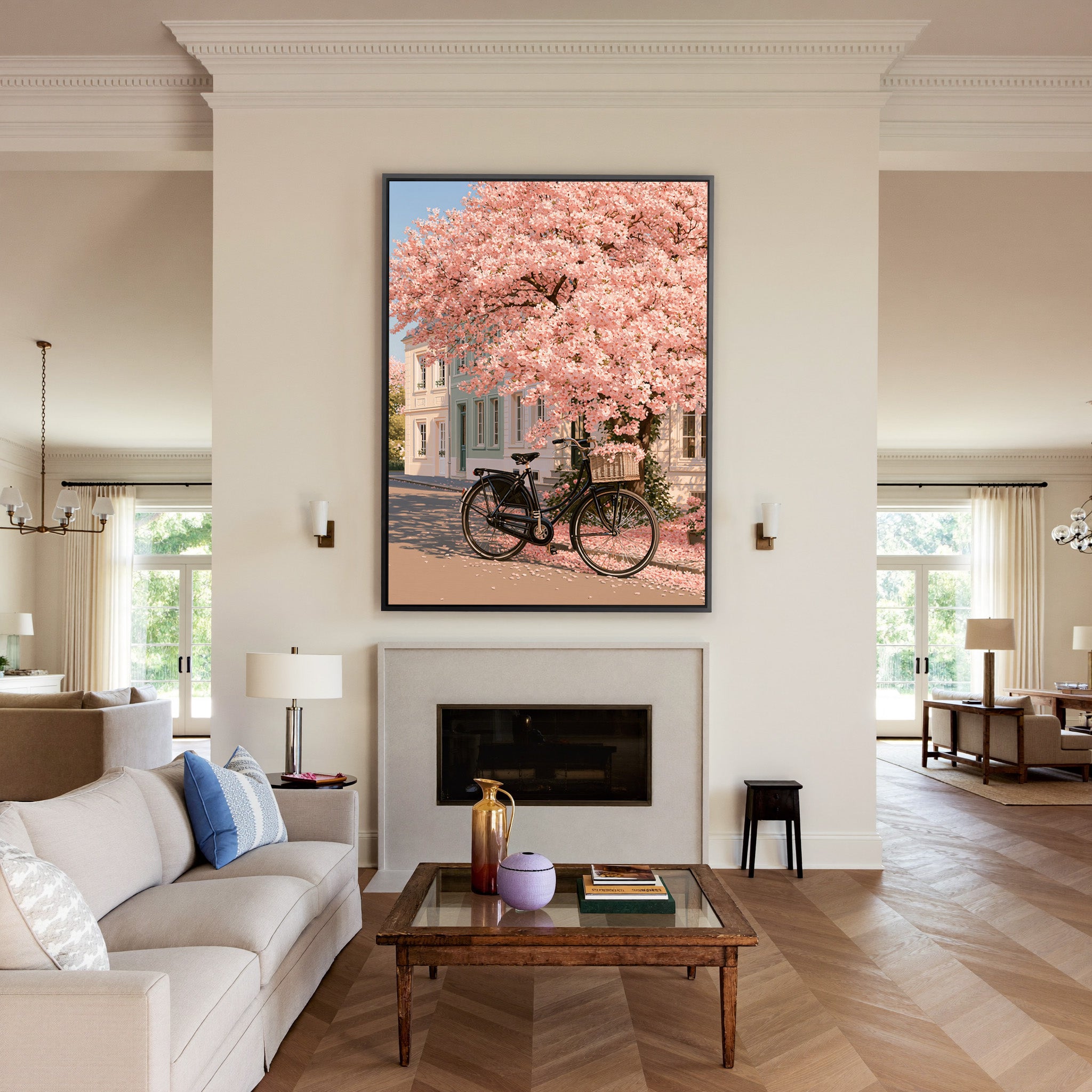 black bicycle beneath pink blossoms canvas wall art in a black frame above a mantel