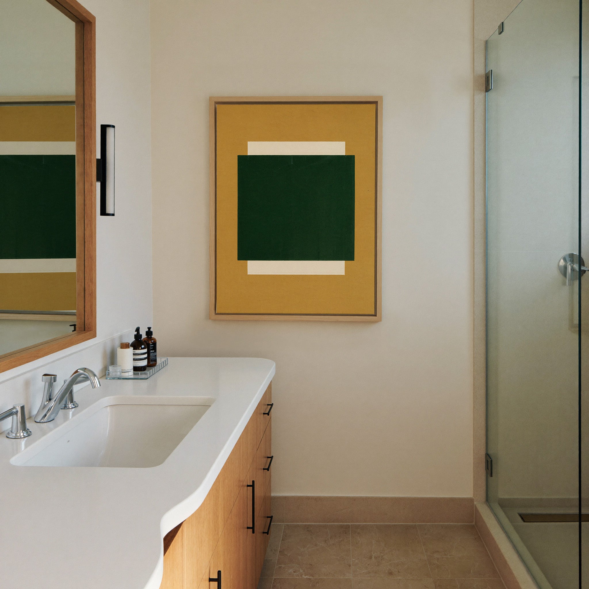 deep green block on ochre ground canvas wall art in a natural wood frame in a styled room setting