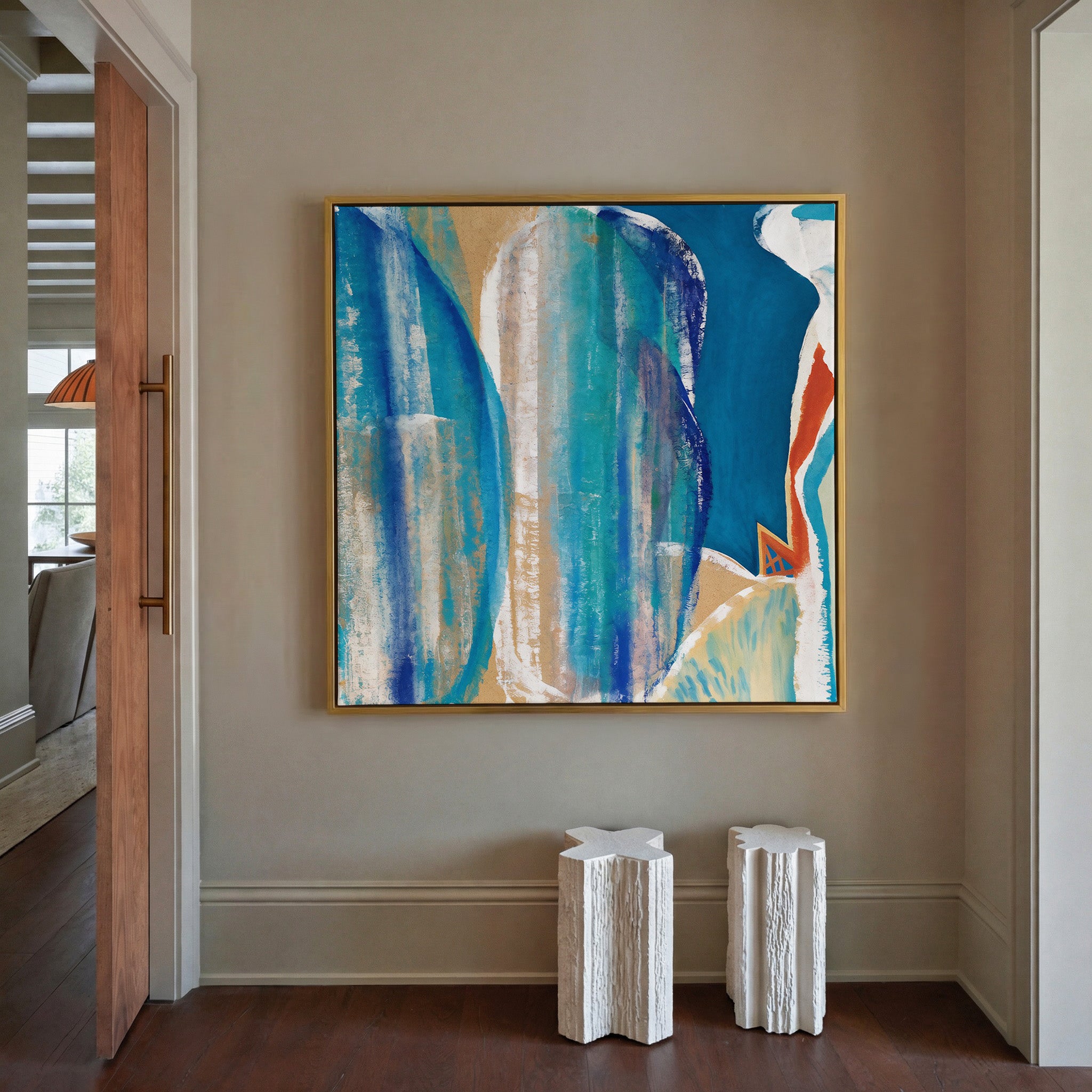 blue and turquoise abstract with cream bands canvas wall art in a gold frame in a styled room setting
