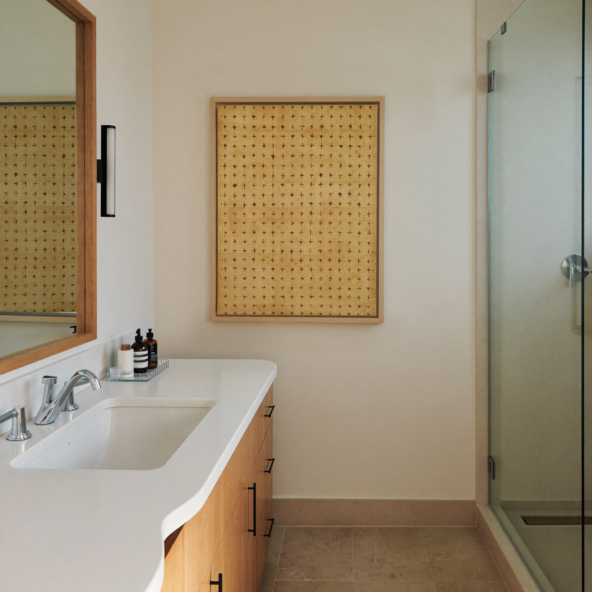 warm ochre abstract with small canvas wall art in a natural wood frame in a styled room setting